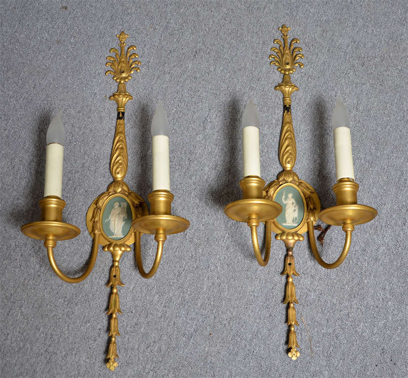 Wonderful pair of neoclassical wall lights with a Wedgwood porcelain medallion.