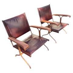 1950's Stitched leather armchairs by Jacques Adnet