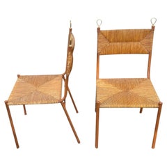 1950's Stitched leather and rattan chairs by Jacques ADNET
