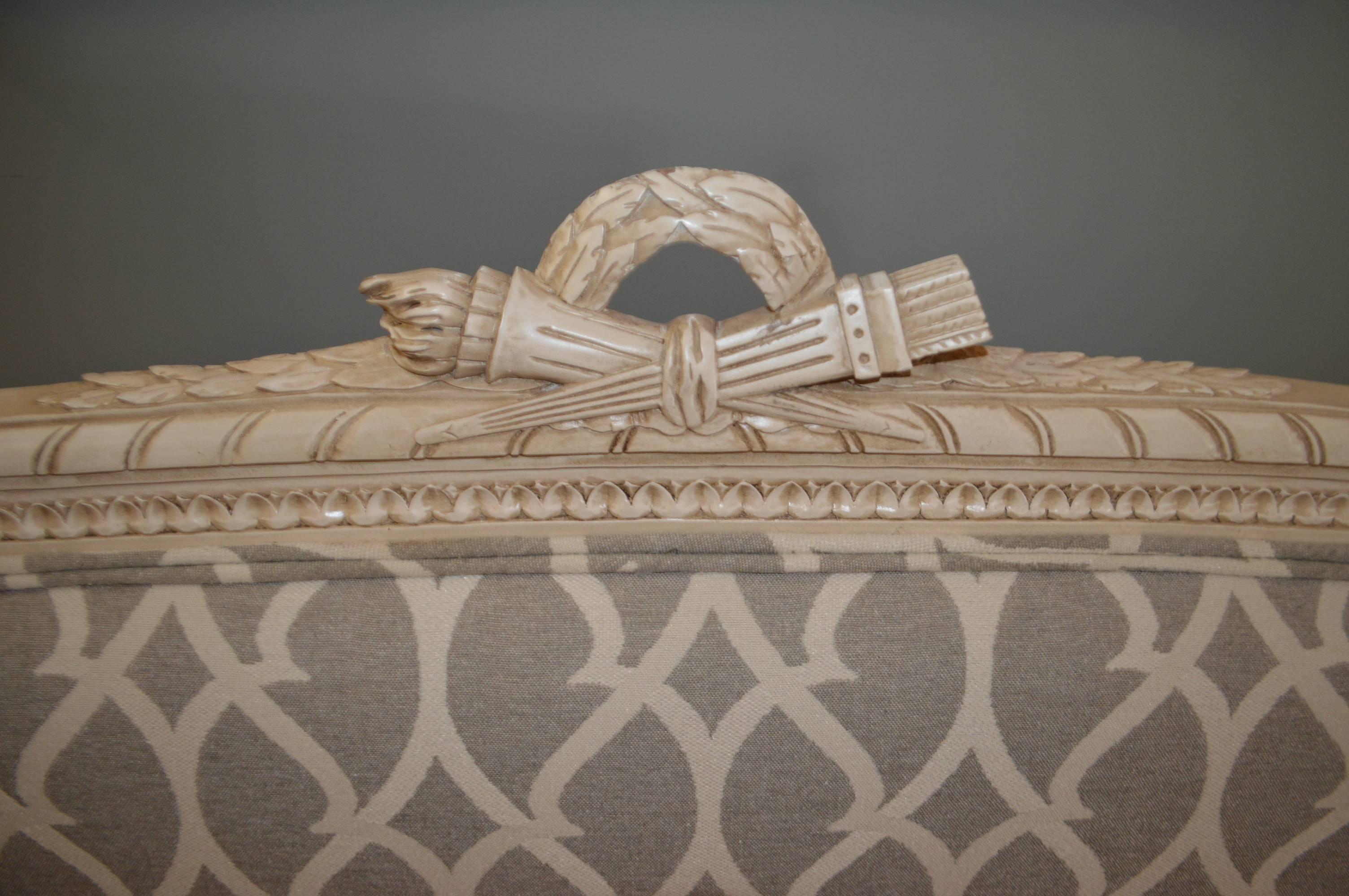 19th century Louis XVI style canapé frame newly painted and upholstered in a grey and cream print weave fabric. Upholstered with new springs and feather top and foam seat cushion. Very comfortable and highly decorative.