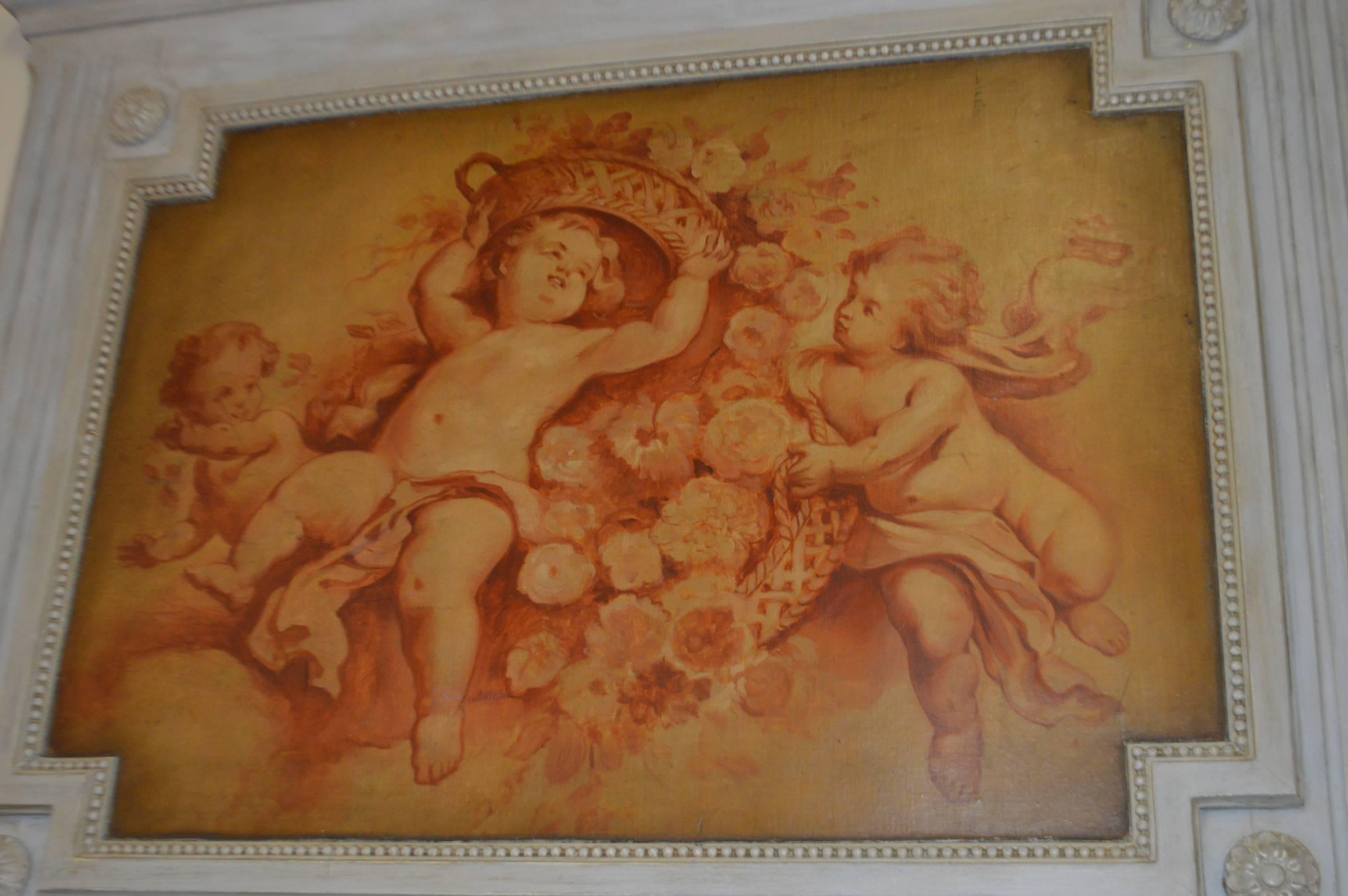 Original oil painting of cherubs on board on this elegant painted Louis XVI style trumeau mirror.