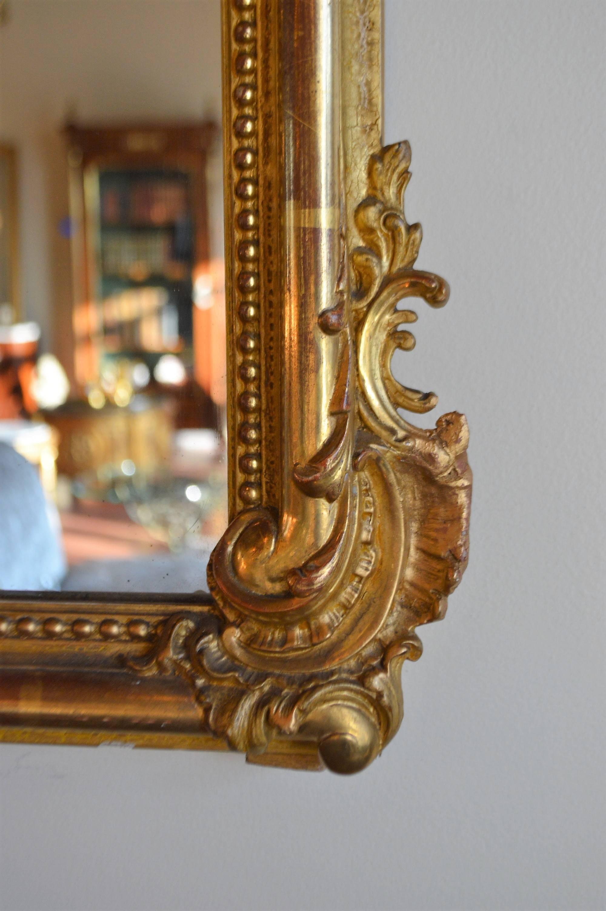 20th Century Louis XV style gilded mirror
