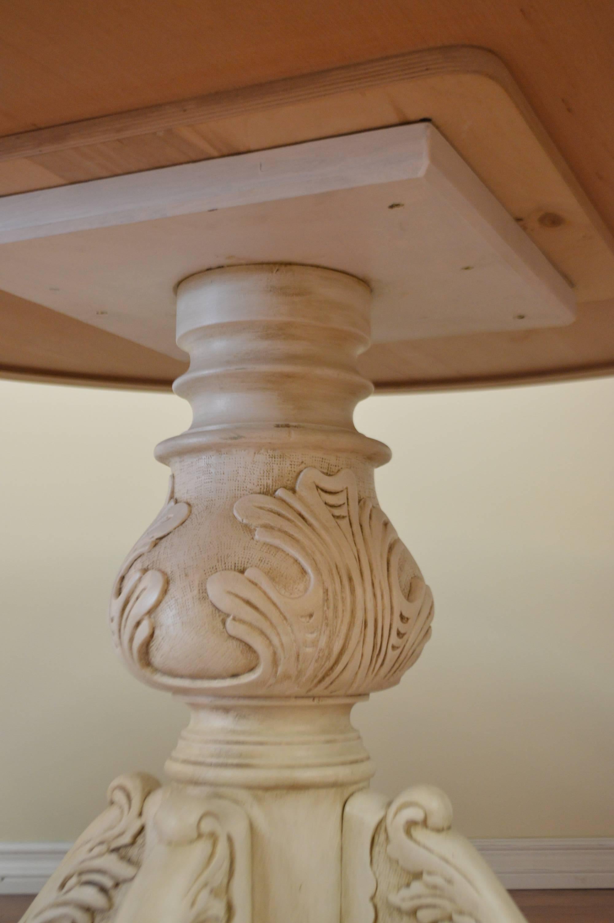 Round table painted over maple, attractive carved pedestal with four carved legs.
A protective coat has been applied to the top making it safe for everyday use.