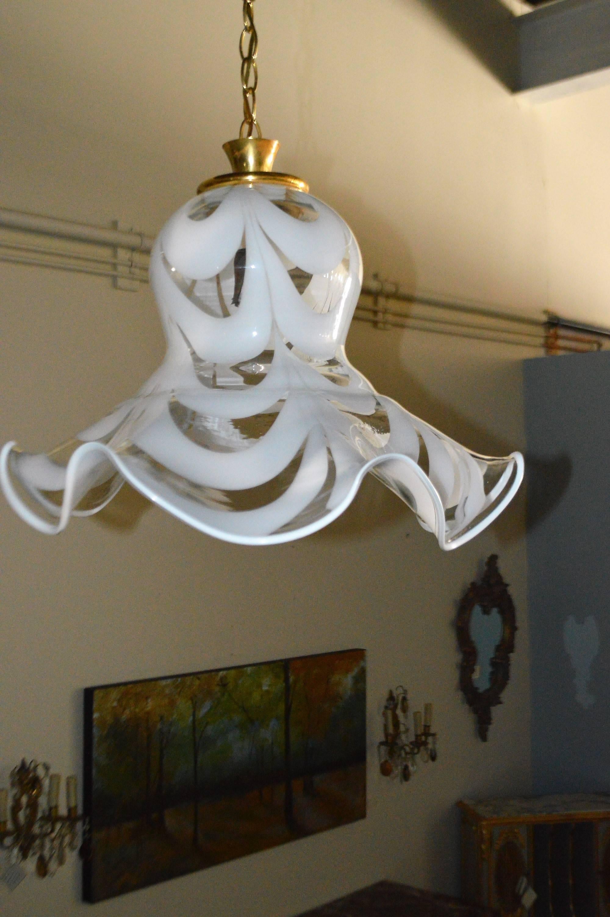 Unusual and decorative Murano glass chandelier in a form of a bell, made for clear and milk glass. He take one bulb in the centre.