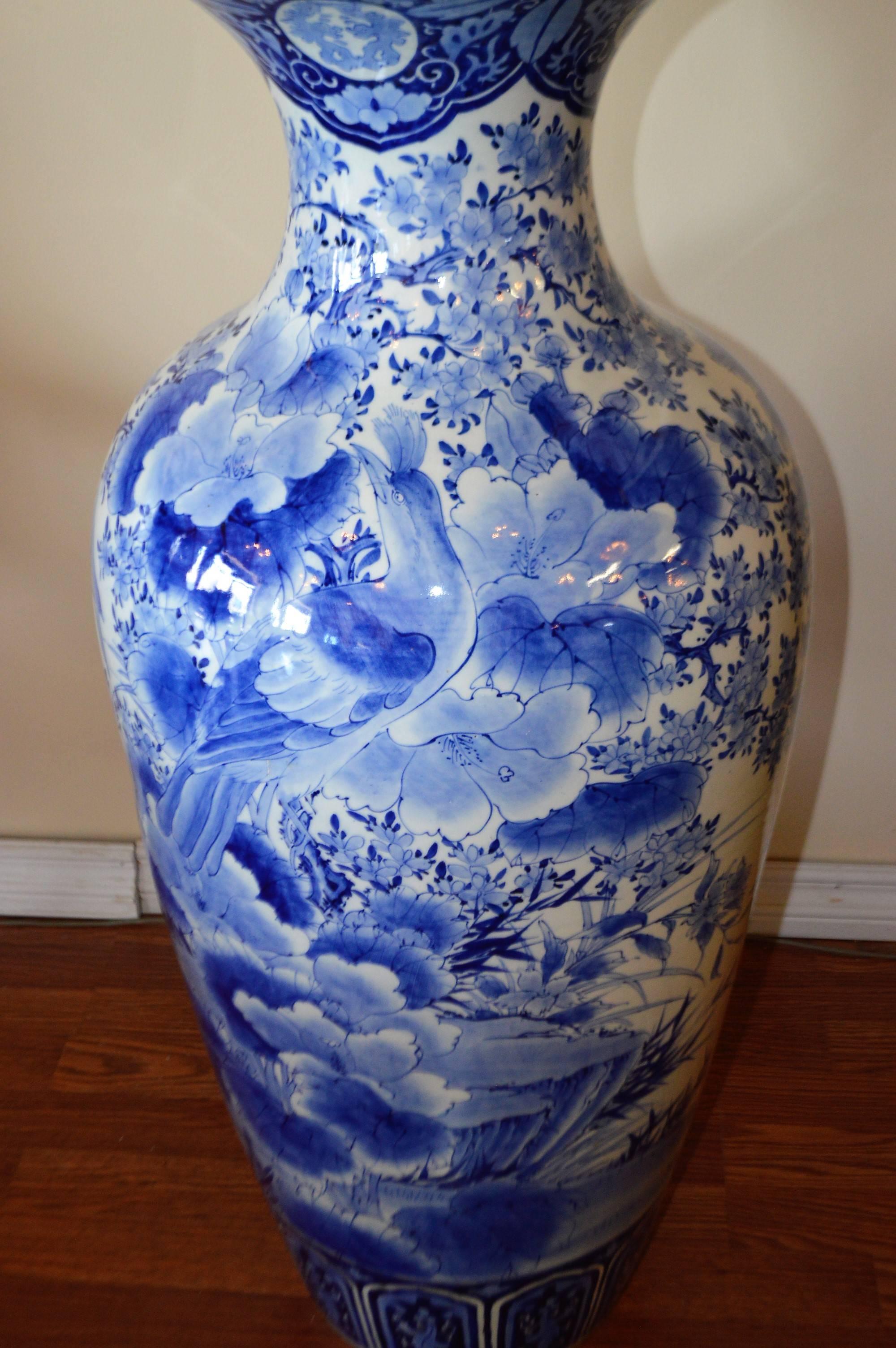 Stunning, large and highly decorative blue and white 19th century imari Japanese hand-painted porcelain vase. Decorated with large peacock birds and large flowers.