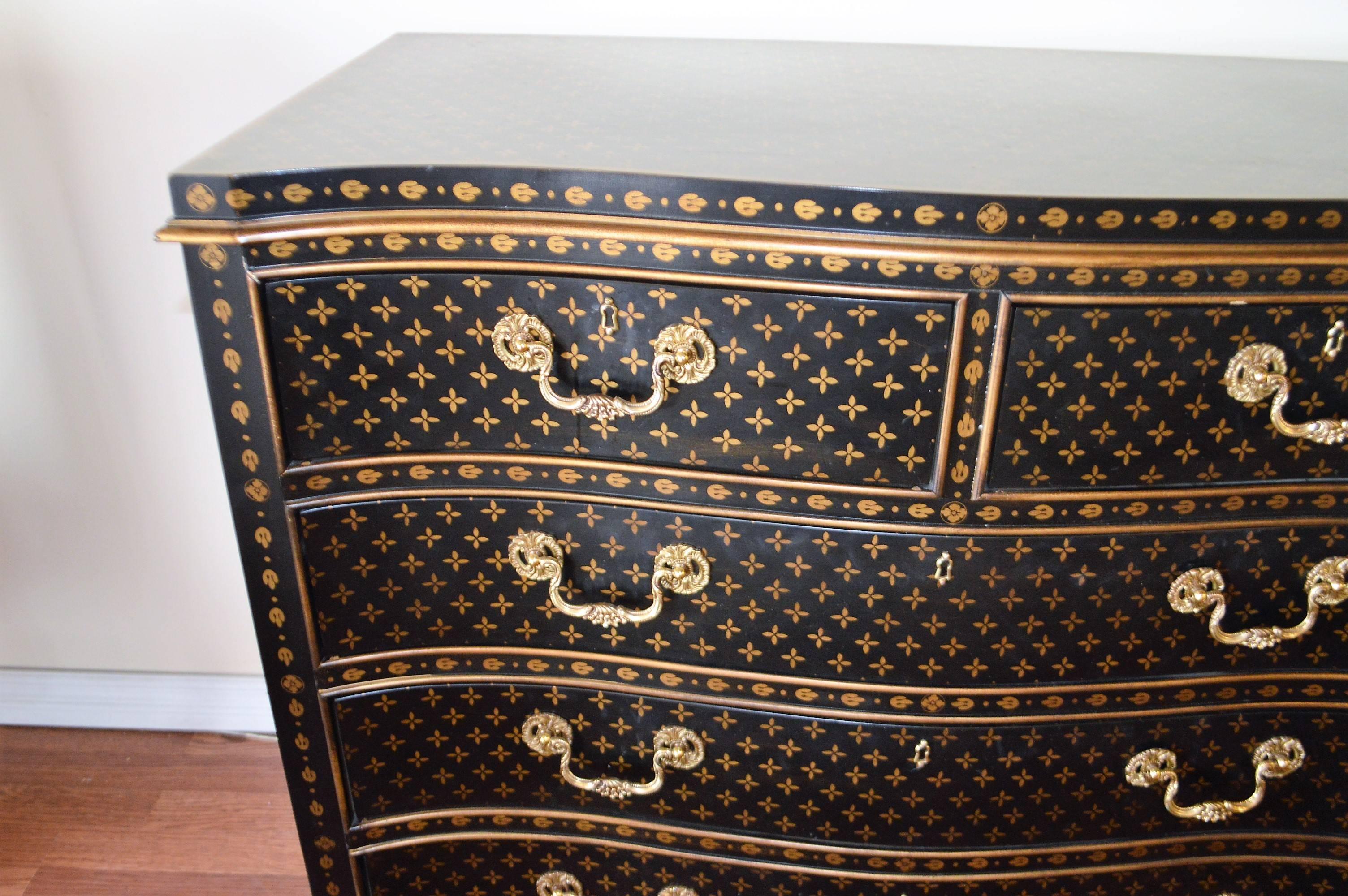 Highly decorative commode, finished in a Louis Vuitton inspired design with rich brass hardware. A very well made, all wood, heavy commode.