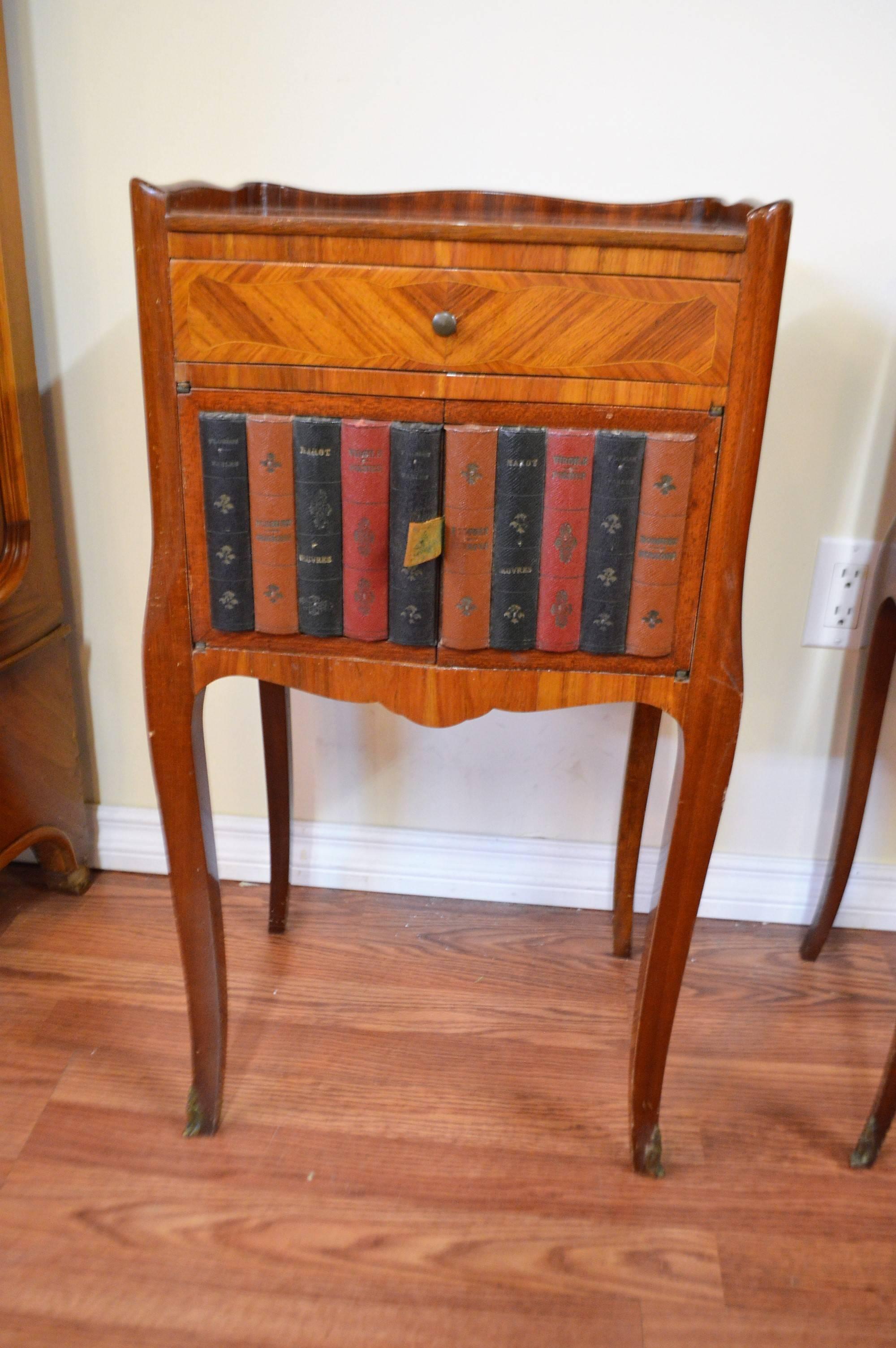 Unusual pair of Transitional wood inlay side table, night tables, both with compartment and a top drawer. One has a faux leather book exterior.