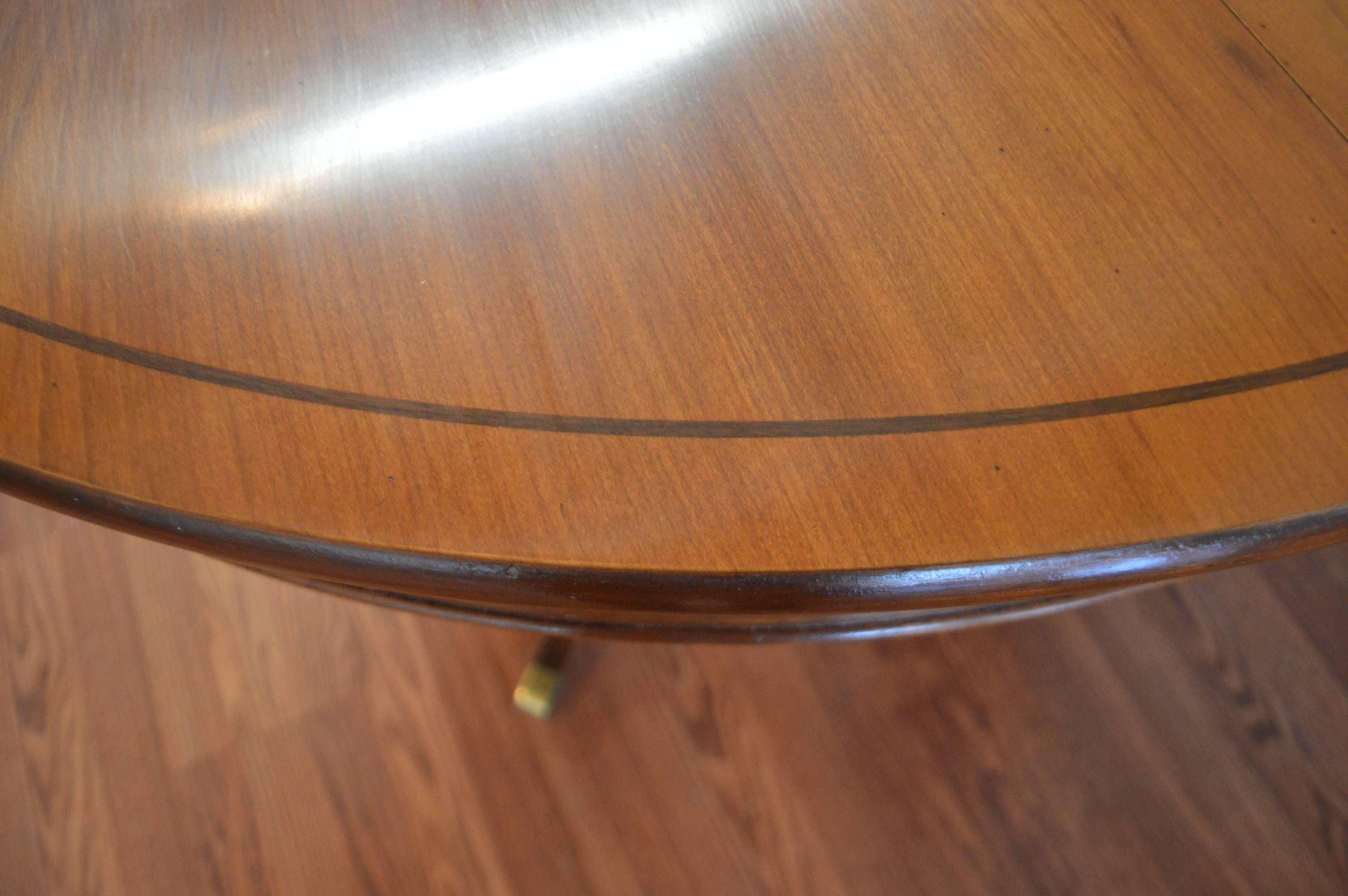20th Century Louis Philippe Style Round Walnut Pedestal Table with Three Unfinished Leaves