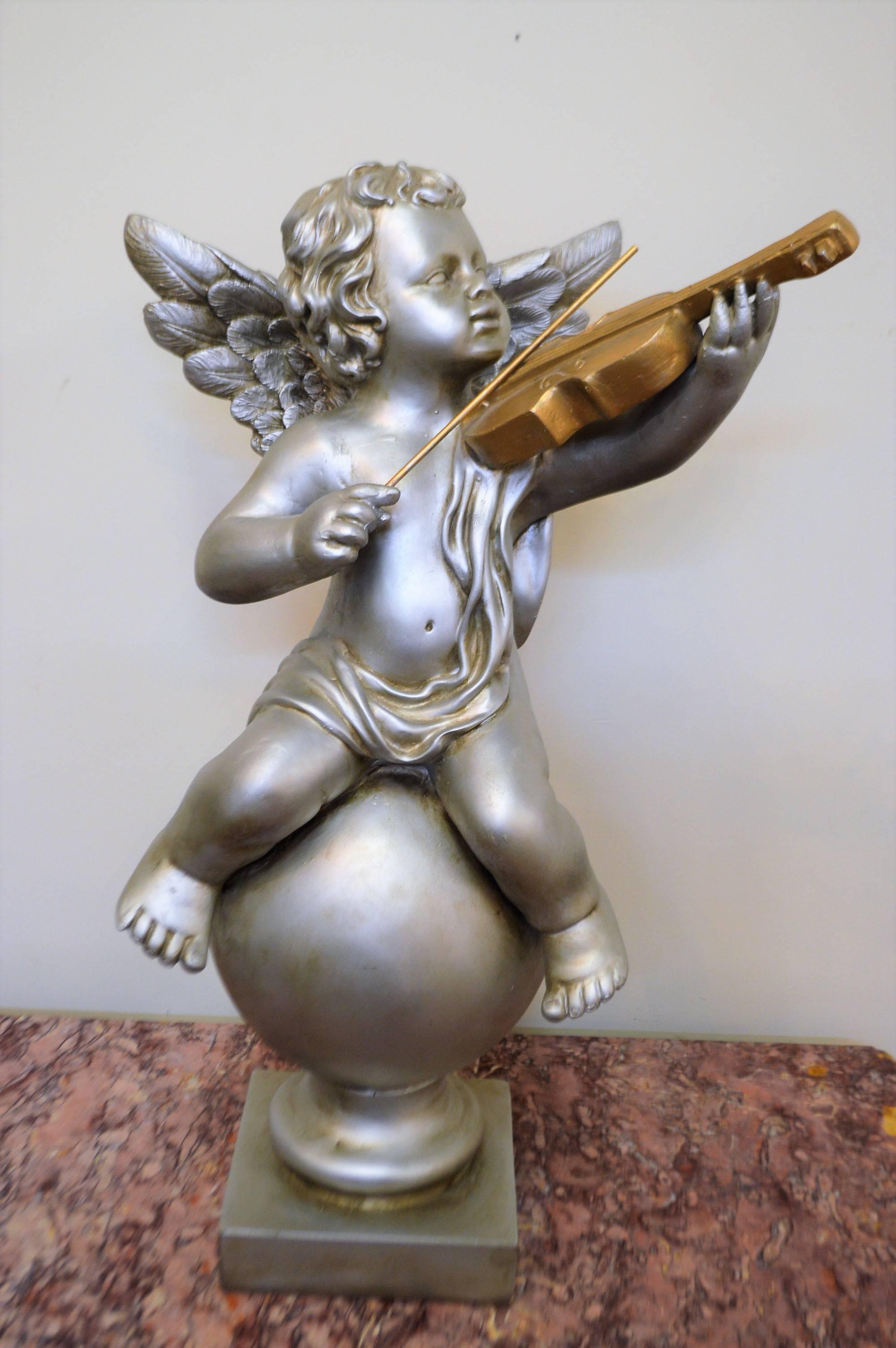 Silvered Pair of Silver Ornamental Musician Cherub Sculptures