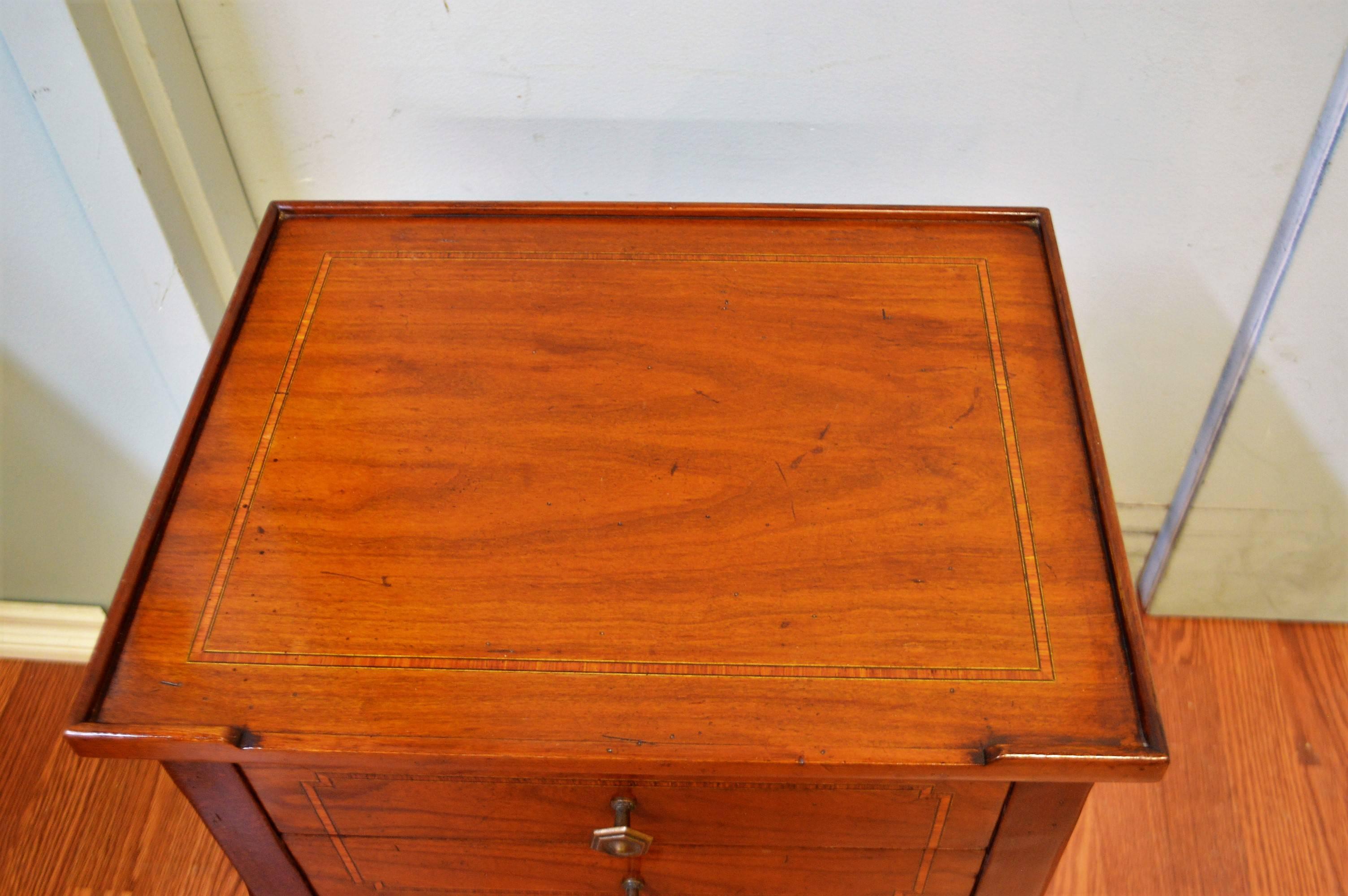Louis XVI style mahogany side table, with inlay pattern on the top and front of the two drawers. it also has a practical lower shelf.
Will enhance any decor, great for night table.