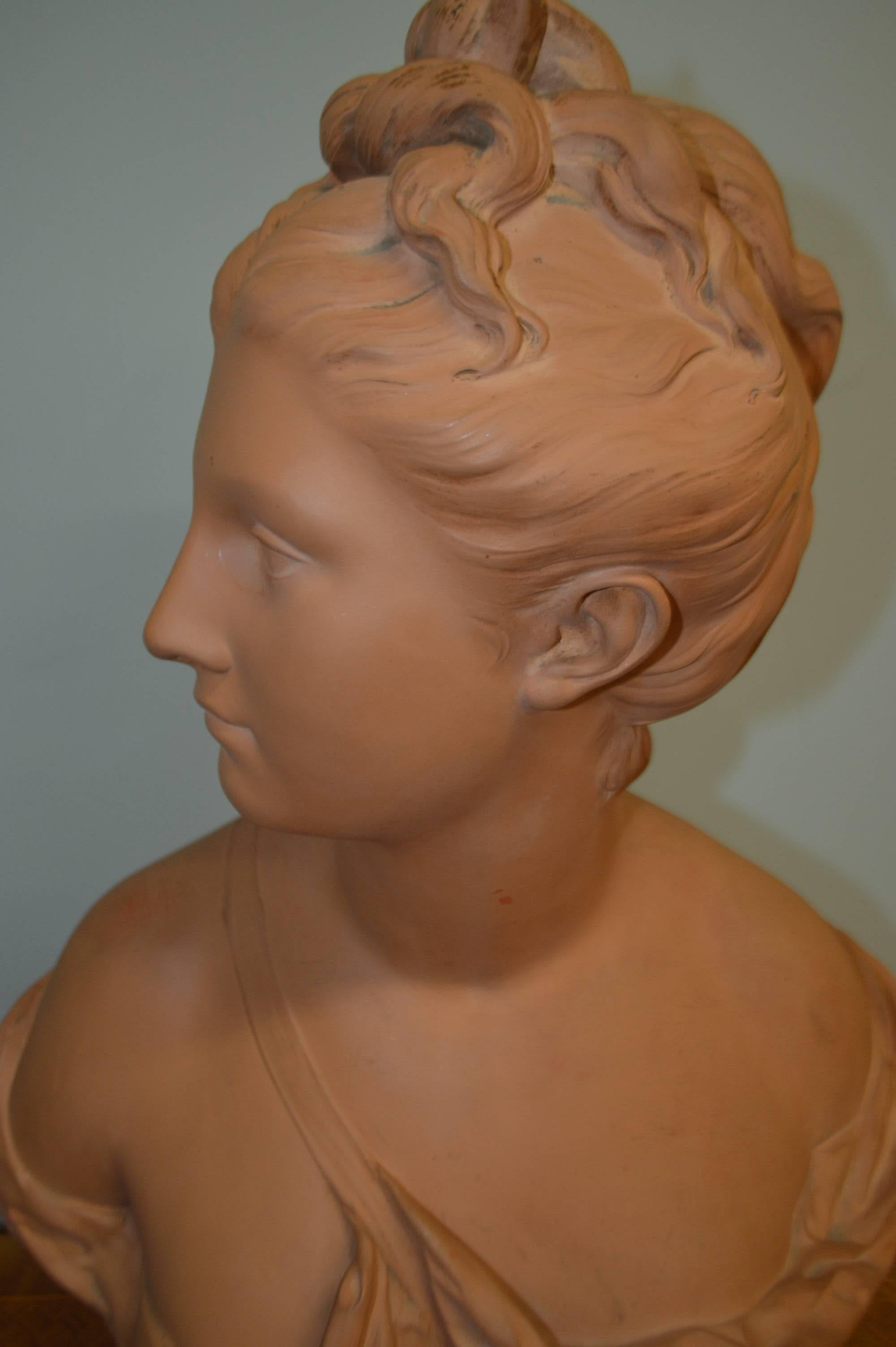 Lovely patina on this terra cotta bust of Diana by A. Houdon signature and seal from France.