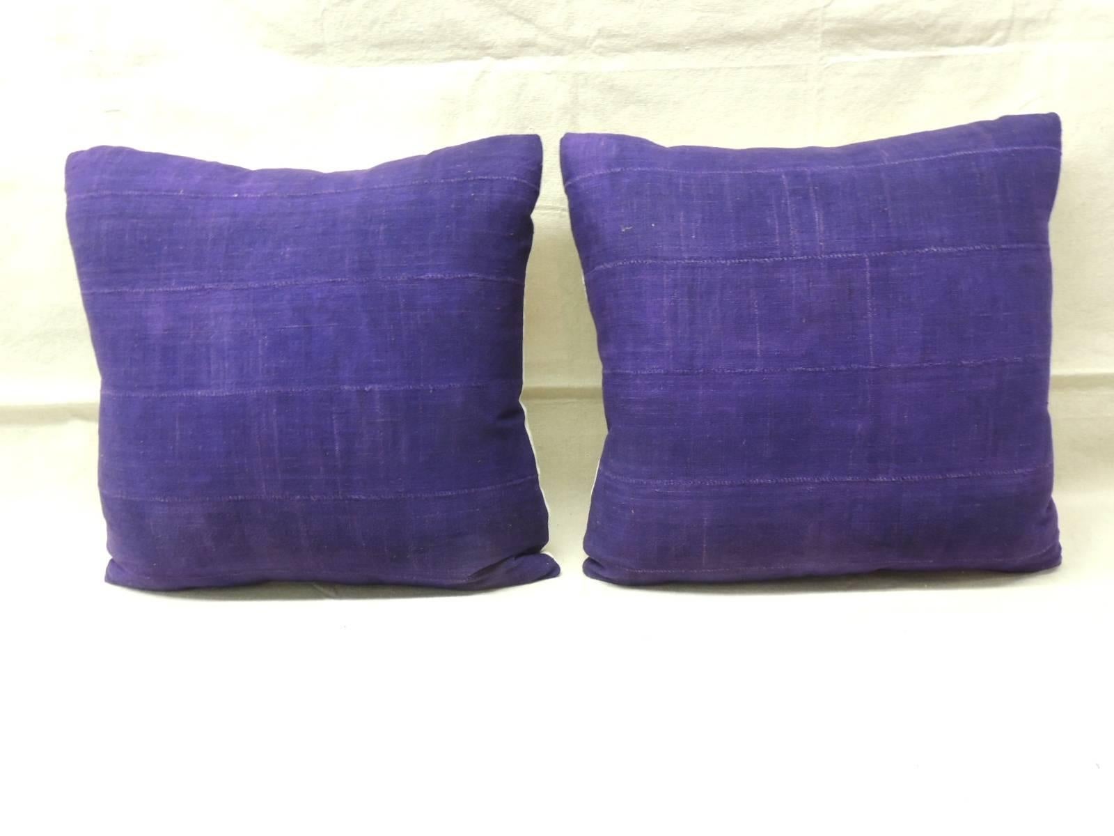 Pair of African deep purple mud cloth decorative pillows with natural vintage linen backing. 
Accent pillows hand-crafted and designed in the USA with custom made pillow inserts. 
Decorative pillows with hand-stitched closure (no zipper.)
Ideal for
