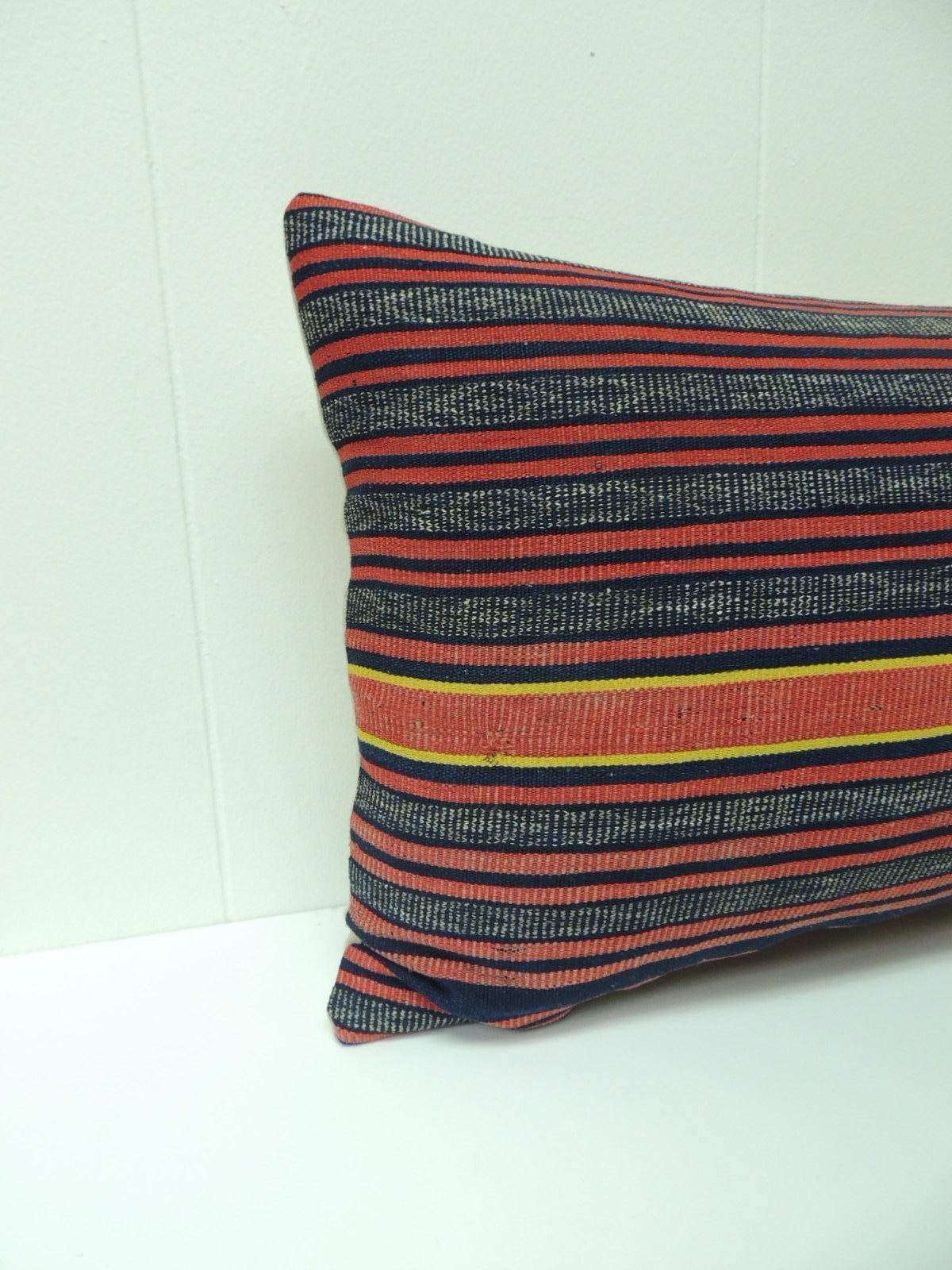 Blue and red stripe bolster accent pillow with yellow stripes in the centre, textured textile and natural linen backing. Throw vintage pillow handcrafted and designed in the USA. Closure by stitch (no zipper) with a custom made pillow insert.
Ideal