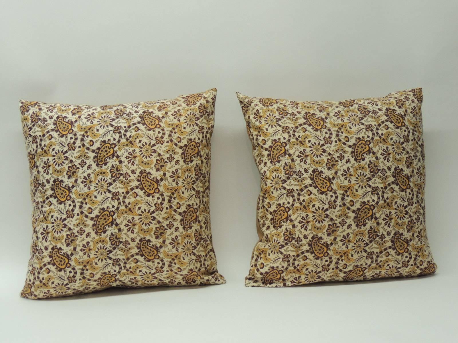 Antique Textiles Galleries:
Pair of hand blocked batik decorative printed Indian yellow paisley pillows, cotton backing in soft camel color.  Throw vintage pillows hand-crafted and designed in the USA.  Closure by stitch (no zipper) with a custom