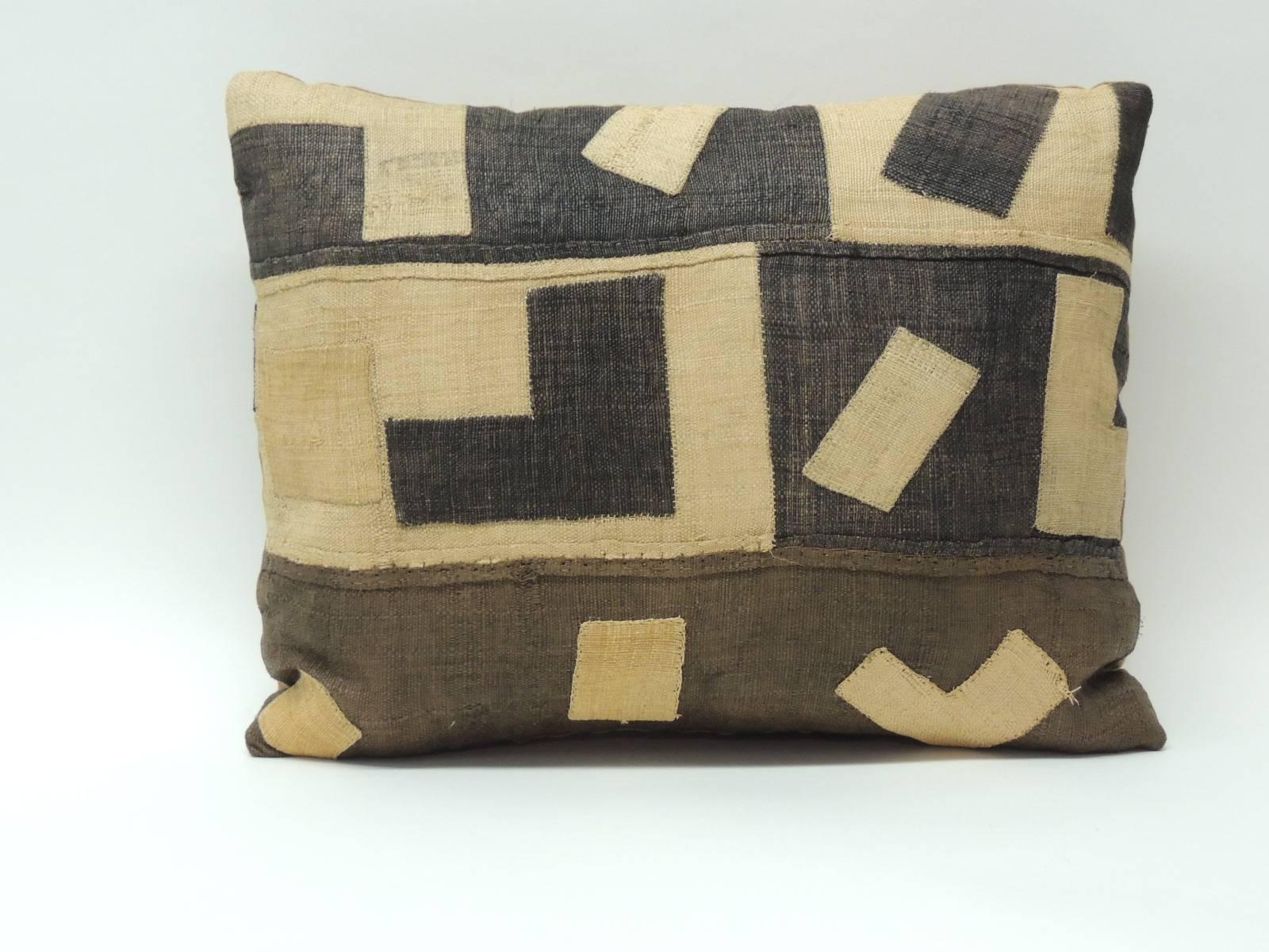 Antique Textiles Galleries:
African Kuba raffia patchwork appliqué lumbar pillow. This Boho-chic style pillow depicts an amazing tribal design. Artisanal textured fragment in shades of brown, black, natural with a tan vintage cotton backing.  Throw