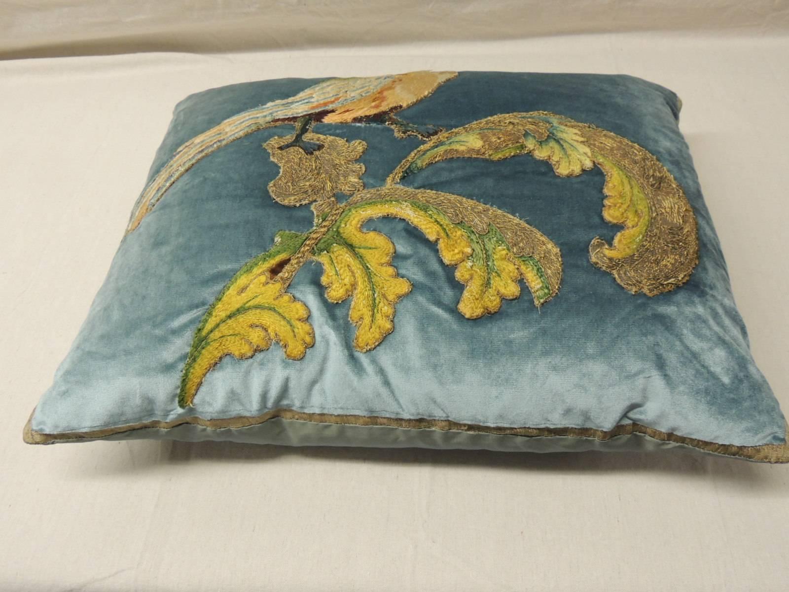 Silk velvet yellow bird applique bolster pillow, 18th century bird embroidery re-applied to 20th century silk velvet in blue. Decorative metallic antique trim around, blue silk backing.