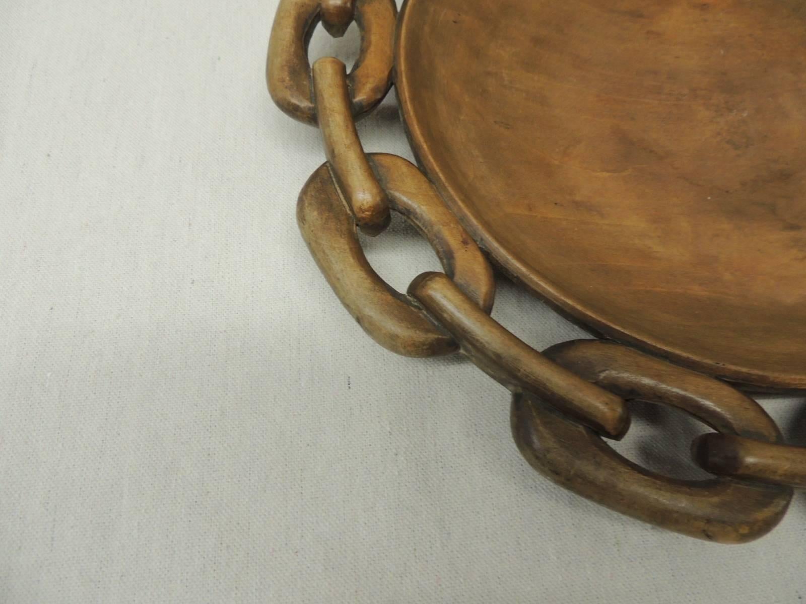 Vintage Mid-Century Modern round wood tray with links all around. Light wood finish. The links almost look like Gucci or Hermes pattern. Signed by the carver. Found in Paris.