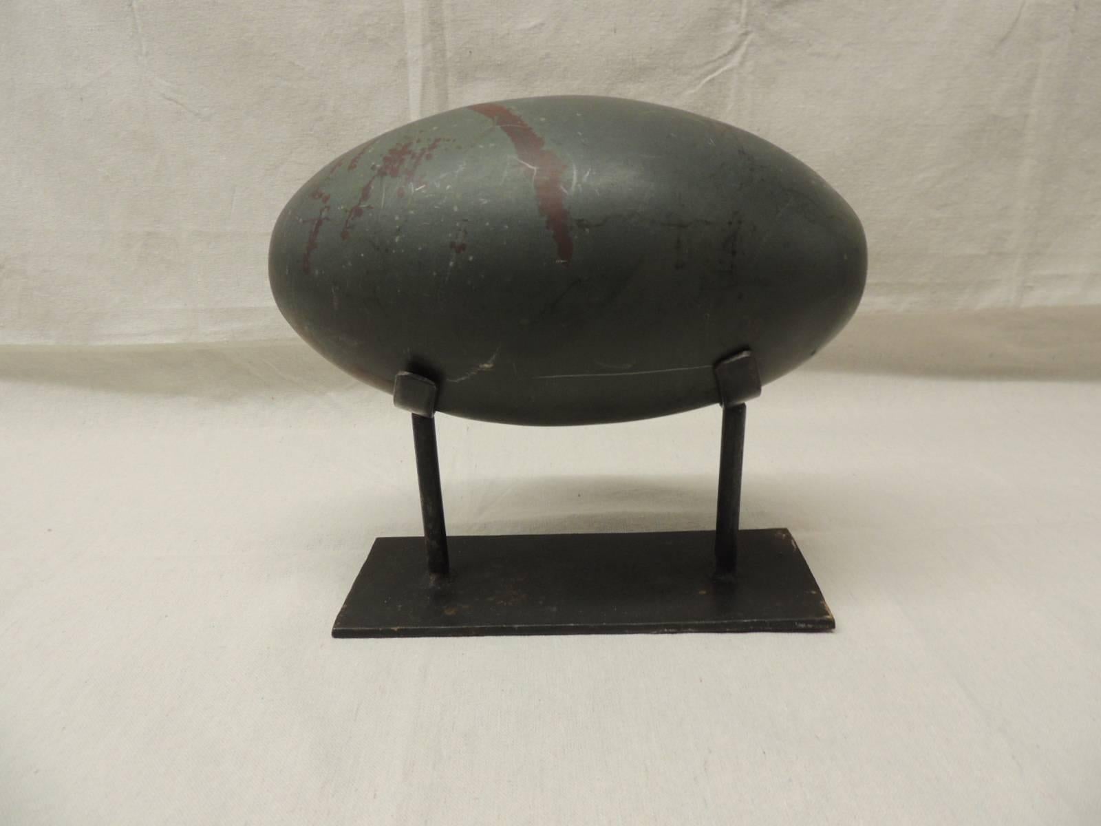 Large Shiva sculptural stone egg on custom iron stand. Deep grey and red natural coloring.
Stand: 10 x 4 x 10.