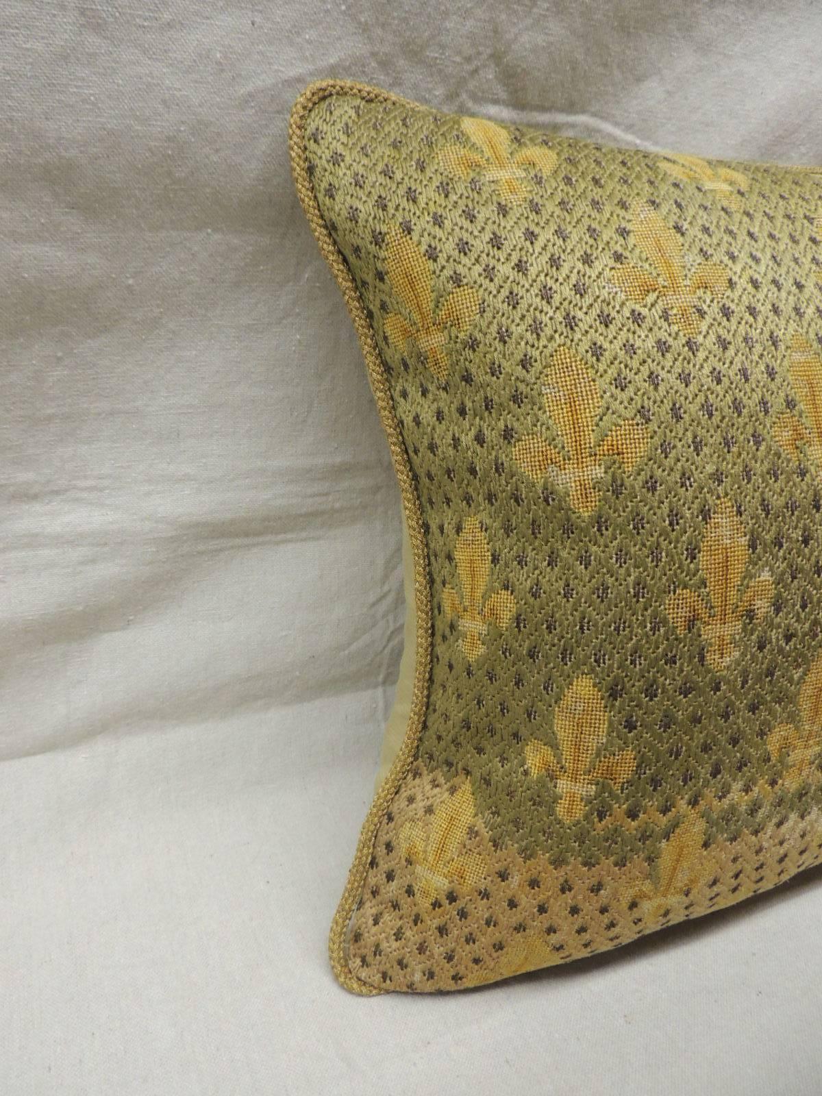 Antique textile fleur-de-lis embroidery tapestry pillow with wool and silk. Encrusted metallic threads in moss and green panel. Golden silk backing and gold metallic rope trim all around. Antique decorative pillow handmade and designed in the USA.