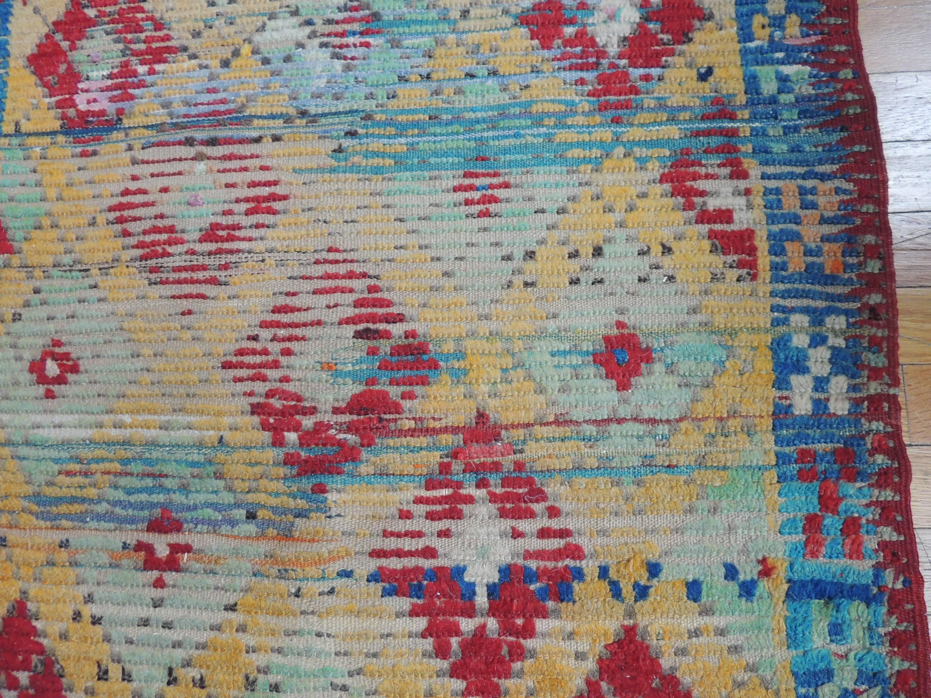 Vintage colorful Anatolian rug/runner, diamond, tribal design. In shades of red, bright blue, yellow, orange and natural. 
With small twisted fringes on either ends.
Ideal for an entry hall or at the foot of the bed.
Size: 33 x 51