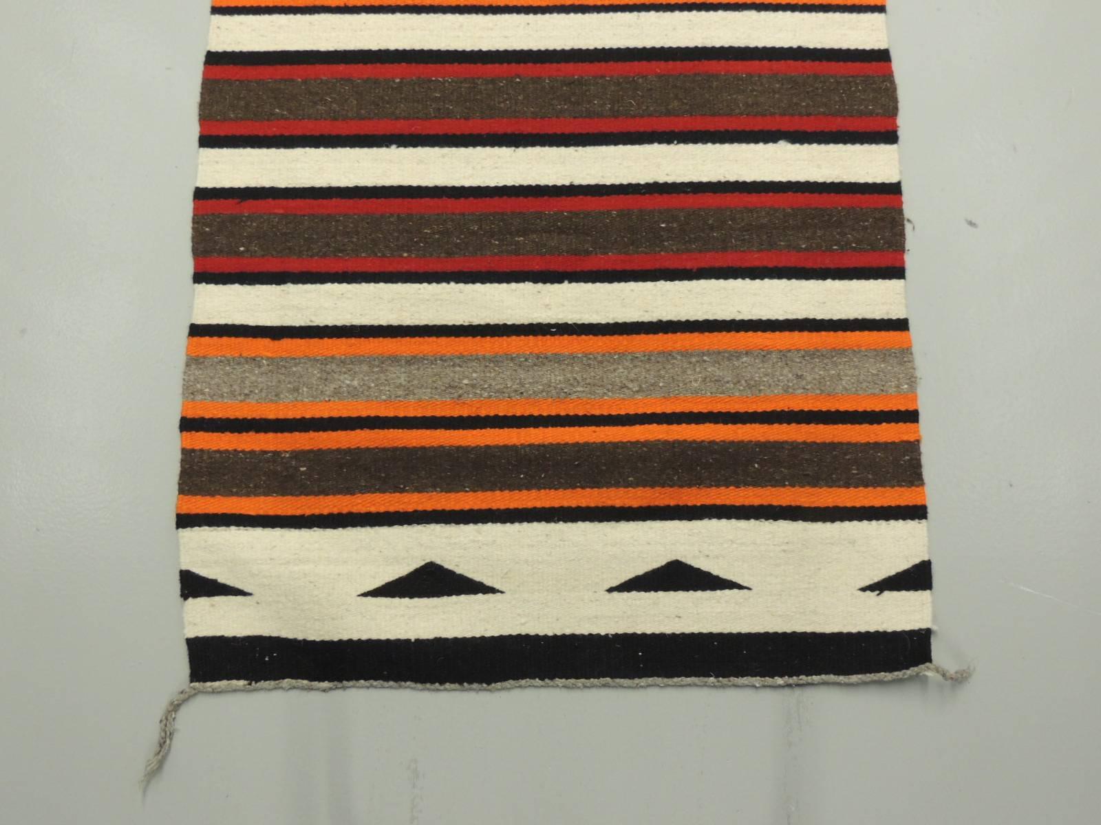 Vintage southwestern Indian colorful stripe rug/runner. In shades of bright orange, brown, natural, green and grey,