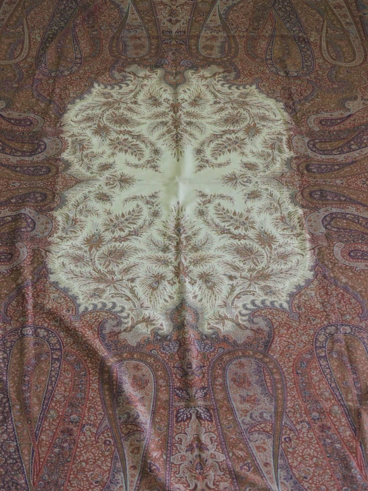 Monumental 19th century paisley Kashmir shawl/cloth. Large-scale paisley pattern with natural color center medallion. Tapestry-twill double interlocked at each joining field. Needle embroidery. In shades of orange, brown, natural, soft green,