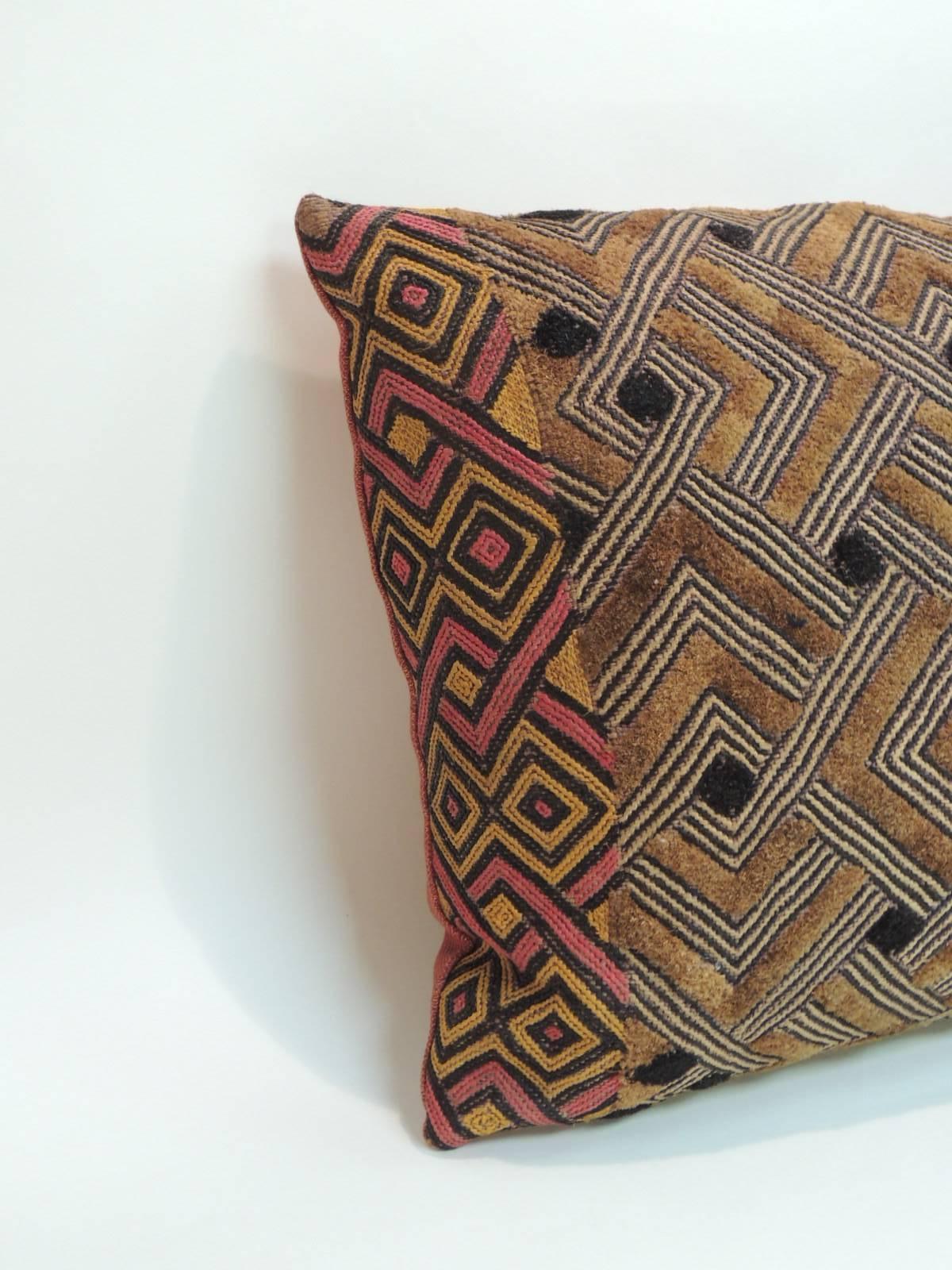 1920’s African Kuba Shoowa or Kasai velvet lumbar pillow with tribal design in shades of red, yellow, black and brown with textured red linen in the back. African textured tribal and artisanal textile on both of the accent Boho-chic style pillows. 