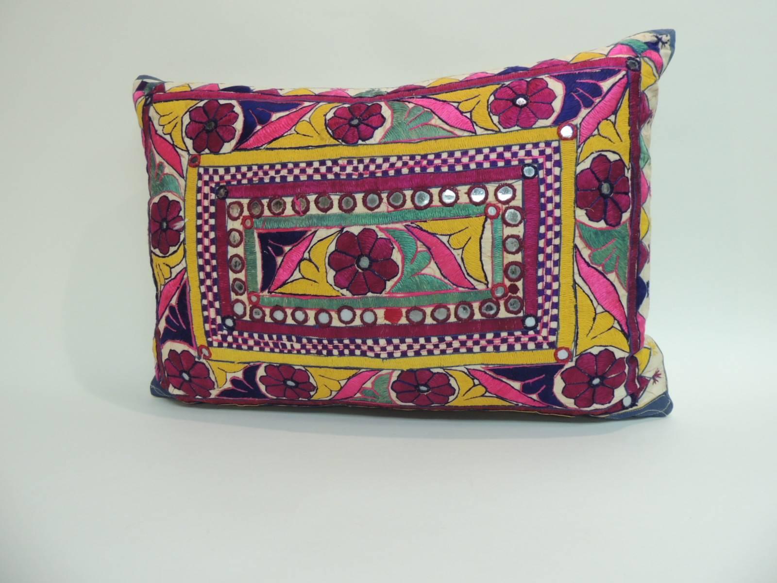 Hand-embroidered Tibetan decorative bolster pillow. Cotton threads on linen with embroidered petite mirror sequins as an adornment throughout very tactile panel in the front. Colorful traditional pattern depicts flowers and leaves and a checkerboard