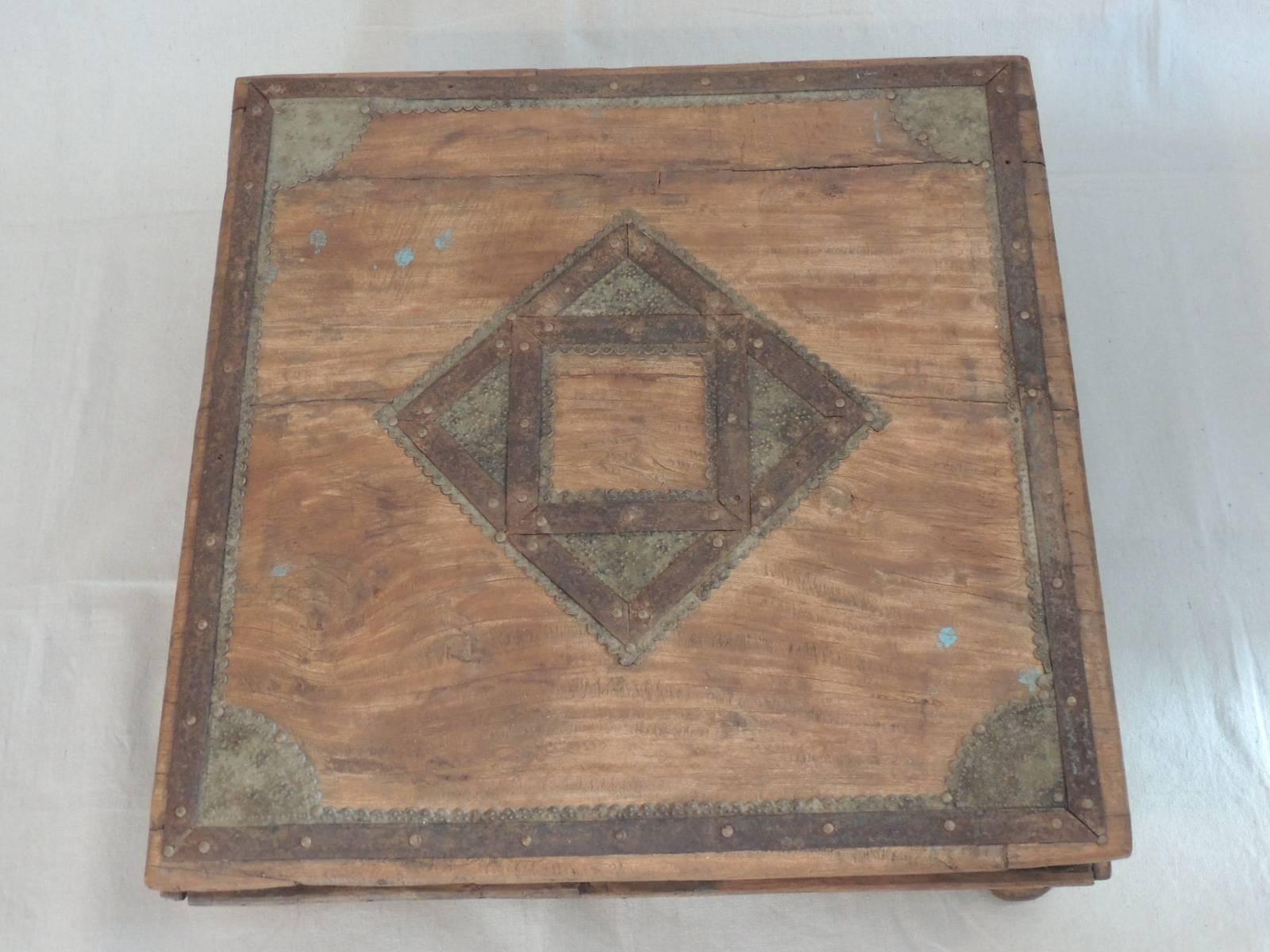 Low Indian square coffee table/low table. Distress wood finish with rustic brass over-lay details. Nice patina altar table.