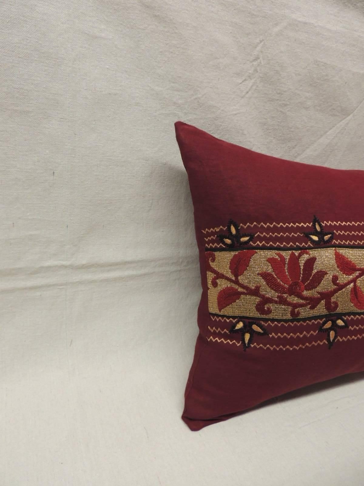 Antique Textiles Galleries...
Vintage 1960s embroidered metallic threads on linen pillow.
Vintage Indian burgundy long bolster pillow with a floral design in shades of black, burgundy, gold and red.. Same linen backing.  Decorative pillow