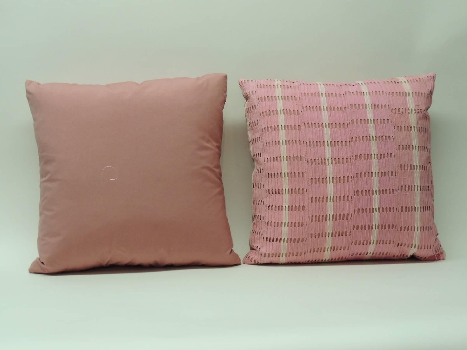 Antique Textiles Galleries:
Pair of pink vintage Yoruba African woven textile pillows. Eyelet design creates a stripe pattern. Hand-crafted and designed in the USA.  Hand stitched (no zipper.)  Custom made pillow inserts.  Pink cotton underlining