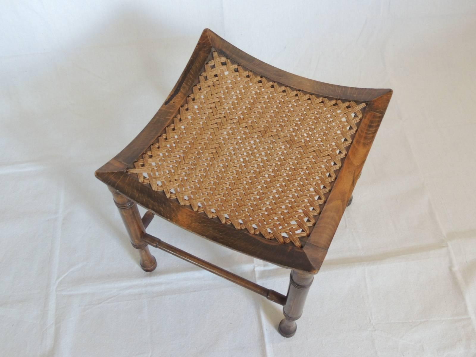 Mid-Century Modern Theves wood stool or ottoman with woven basket weave jute seat. Undulating curve seat, turned wood round stretchers.