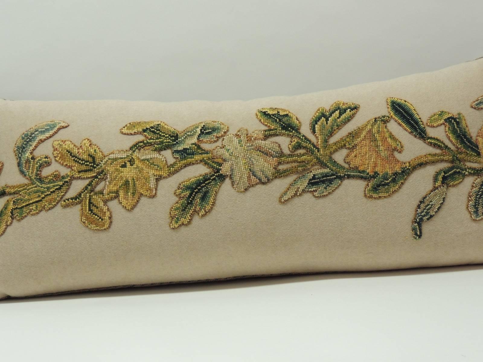 19th century applique wool-on-wool embroidery long bolster “one-of-a-kind” decorative pillow with taupe color wool in the front panel where the embroidery has been applied and a tobacco silk velvet textile in the backing. The decorative long bolster