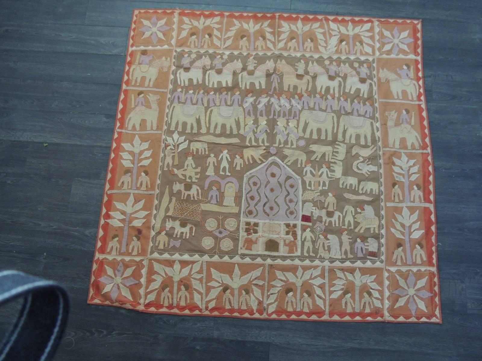 Offered by the Antique Textiles Galleries:
Large vintage Indian appliqué Kanduri shrine cloth  textile depicting palm trees, people, flowers, camels, elephants, a temple, birds, jaguars, donkeys and tigers on light earth tones and in multiple