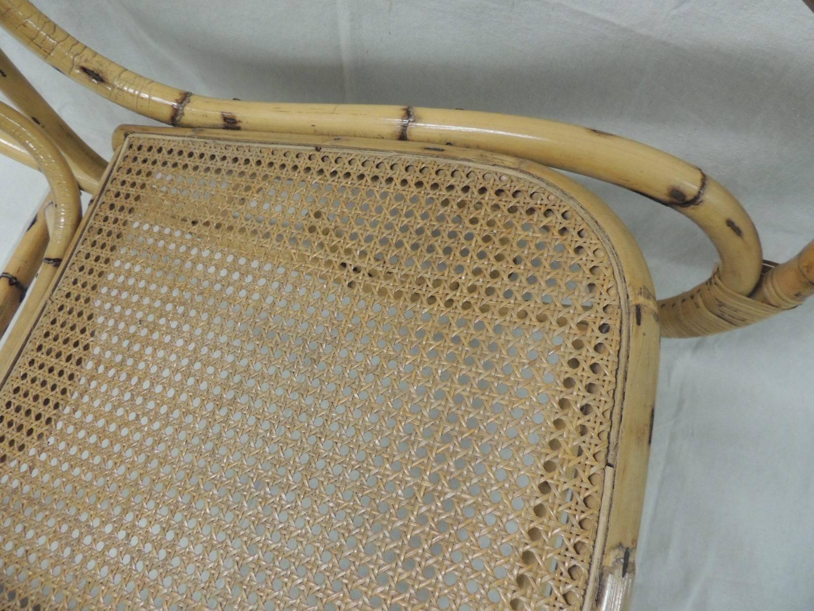 Vintage bamboo and wicker armed rocking chair
1970s vintage bamboo and wicker armed rocking chair with back and set on a trellis design. No repairs or damage in the canning and very sturdy.
Palm beach style, coastal living, porch.
Size: 39” BH x