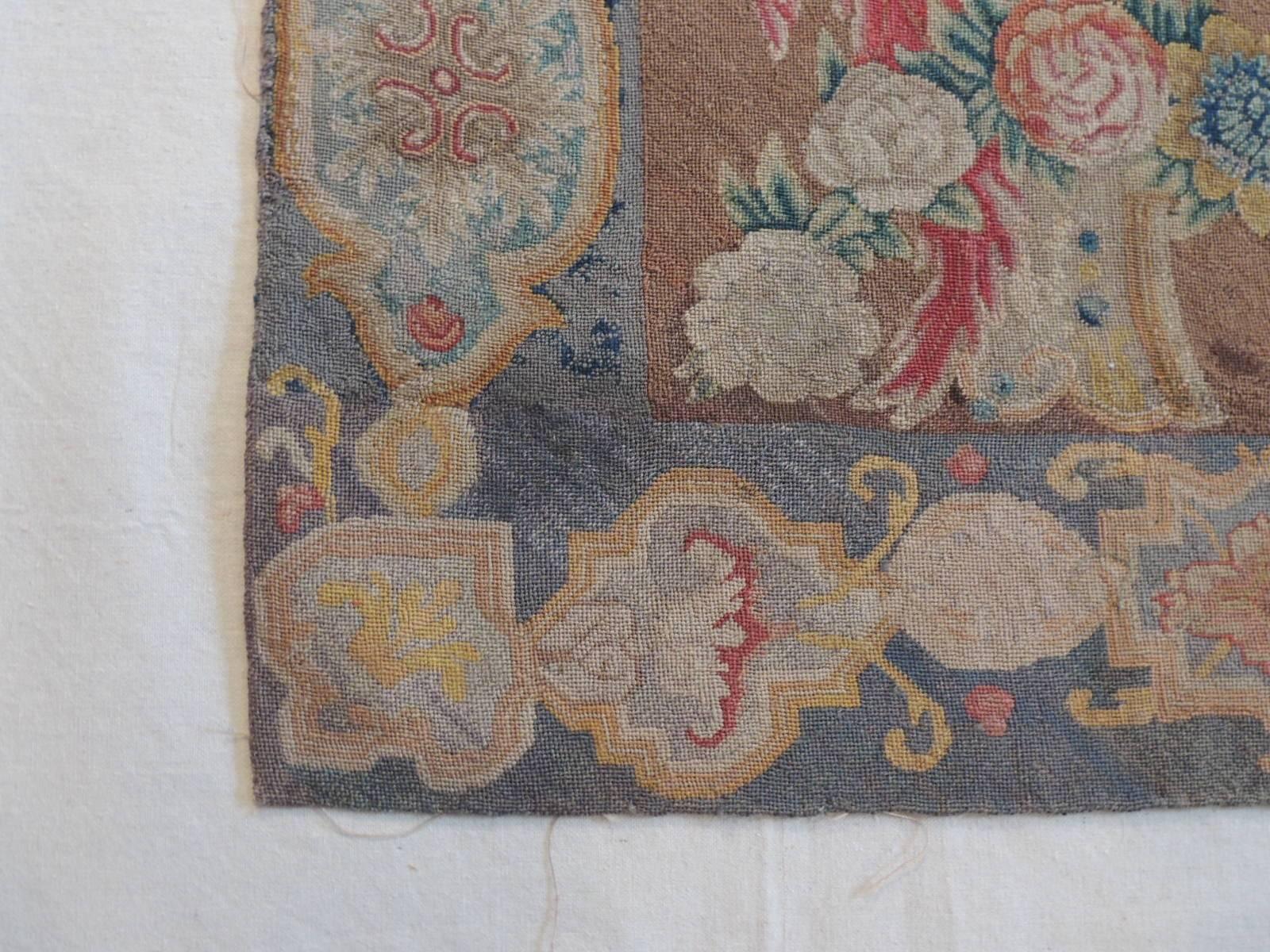 Offered by the Antique Textiles Galleries:
18th century Savonnerie fragment depicting a sea shell in the centre with naturalistic garlands and acanthus leaves on each side to recreate a pictorial medallion in the centre. “A famous rug and tapestry