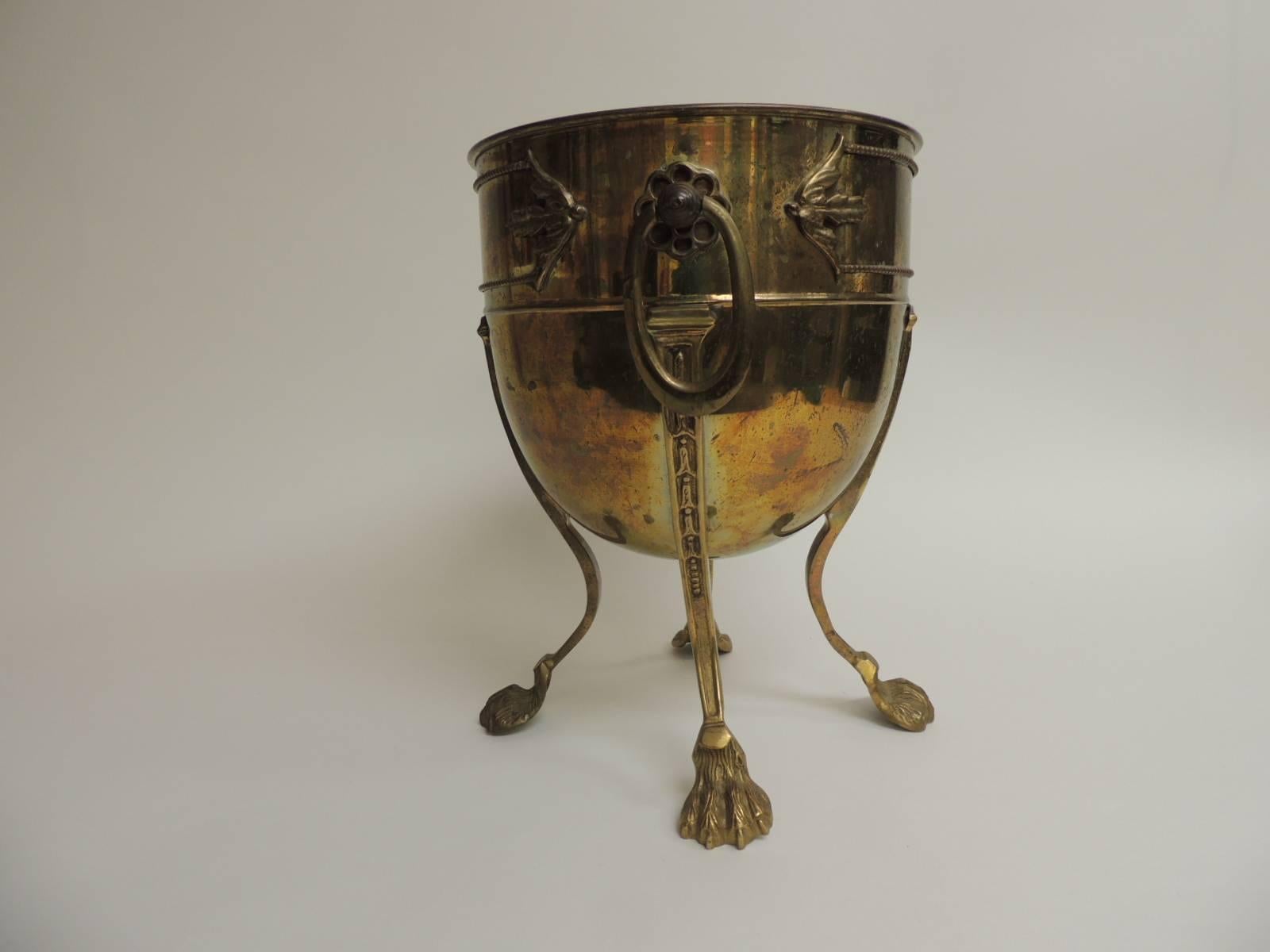 Vintage Indian champagne tall wine cooler. Lions feet with oval hanging handles. Some decorations on top of the cooler. Nice patina. No rust inside or out.
Note: Fits two bottles.