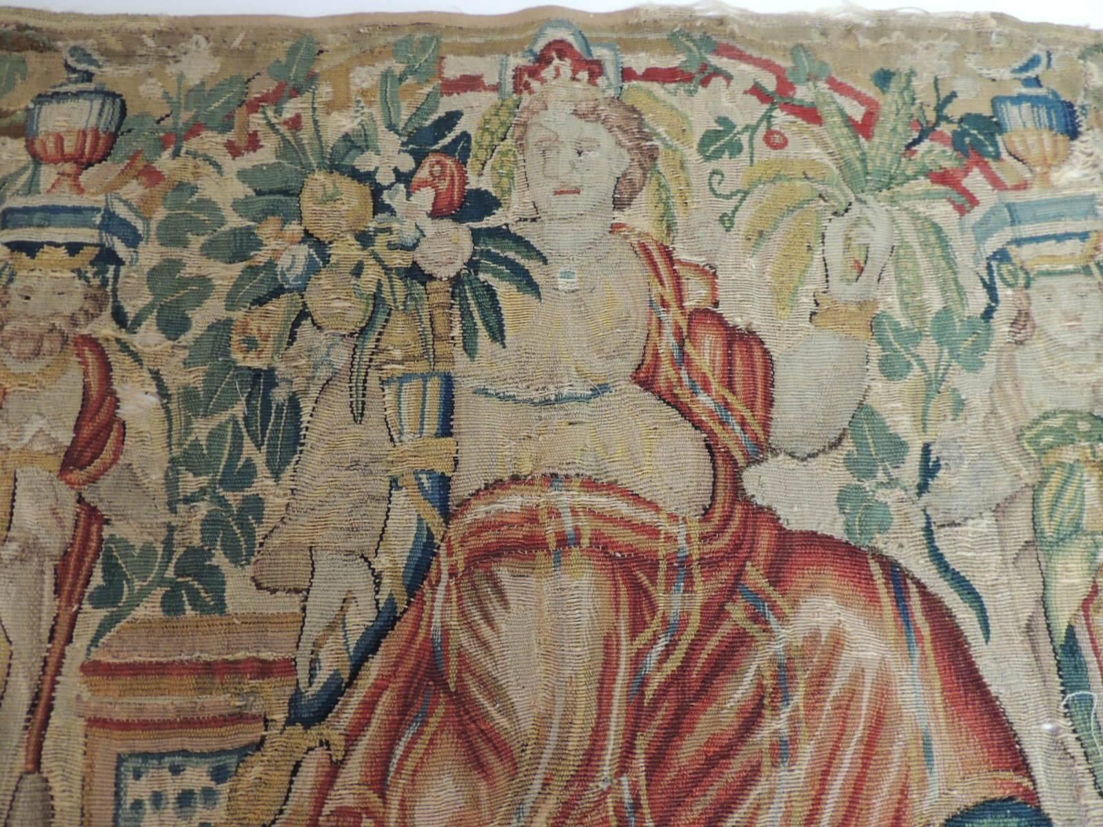 Offered by the Antique Textiles Galleries:
18th century Aubusson tapestry panel of goddess in a red cape.
Aubusson tapestry panel depicting scene of a goddess holding court in a garden arranging flowers with draped red cape and holding a cornucopia