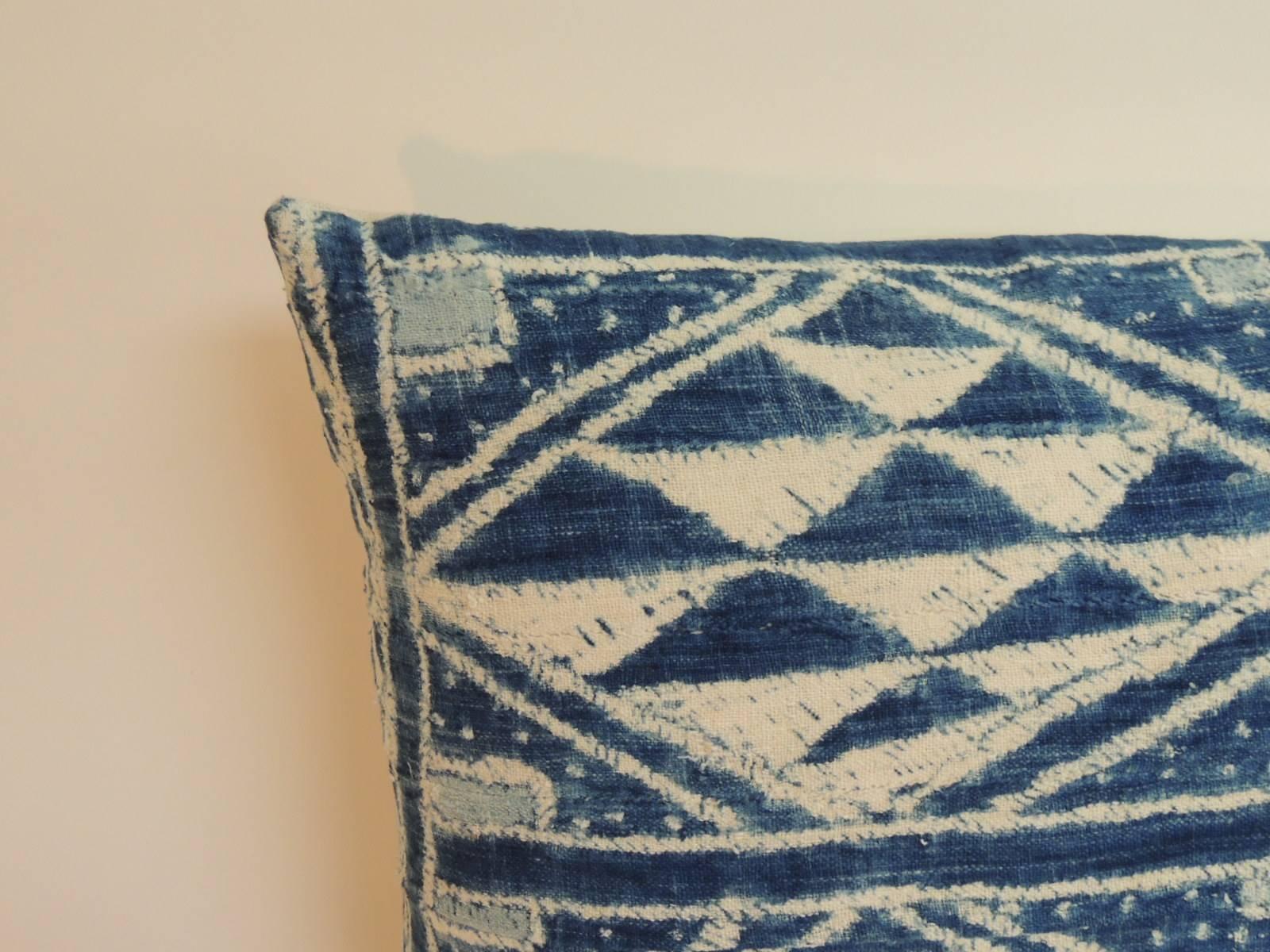 Large blue and white “Ndop” woven African woven decorative bolster pillow with traditional tribal designs and backed with textured white cotton fabric. Decorative pillow designed and handcrafted in the USA. Hand-stitched closure (no zipper.)