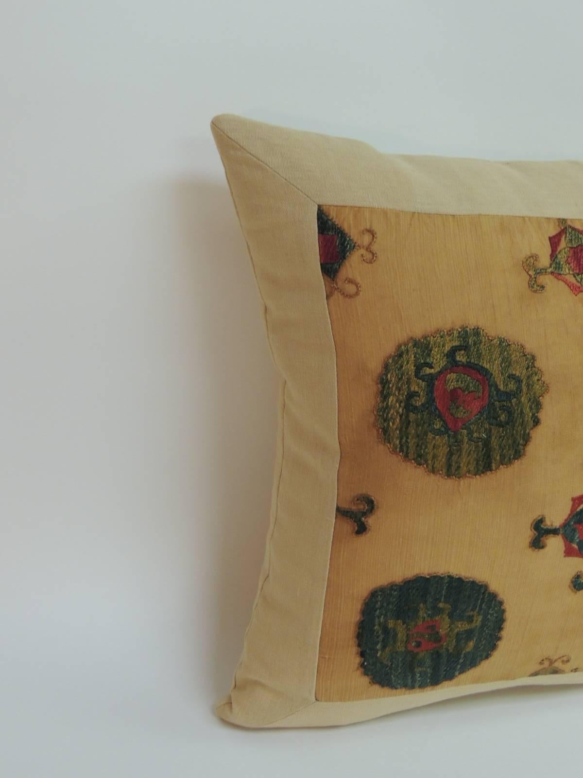 Offered by the Antique Textiles Galleries:
Yellow embroidery silk on cotton medallions Suzani decorative pillow. Antique Suzani textile panel, from Central Asia, has been reinforced and framed with textured soft yellow linen, same as backing. The