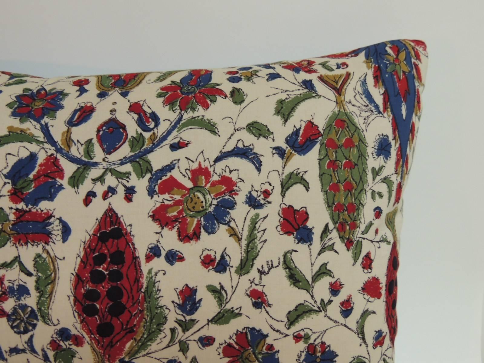 Offered by the Antique Textiles Galleries:
Pair of 1980s vintage cotton multicolor floral on paisley pattern decorative pillows in shades of red, royal blue, tan, green finished on an ecru background with basket weave wedge wood blue linen backing.