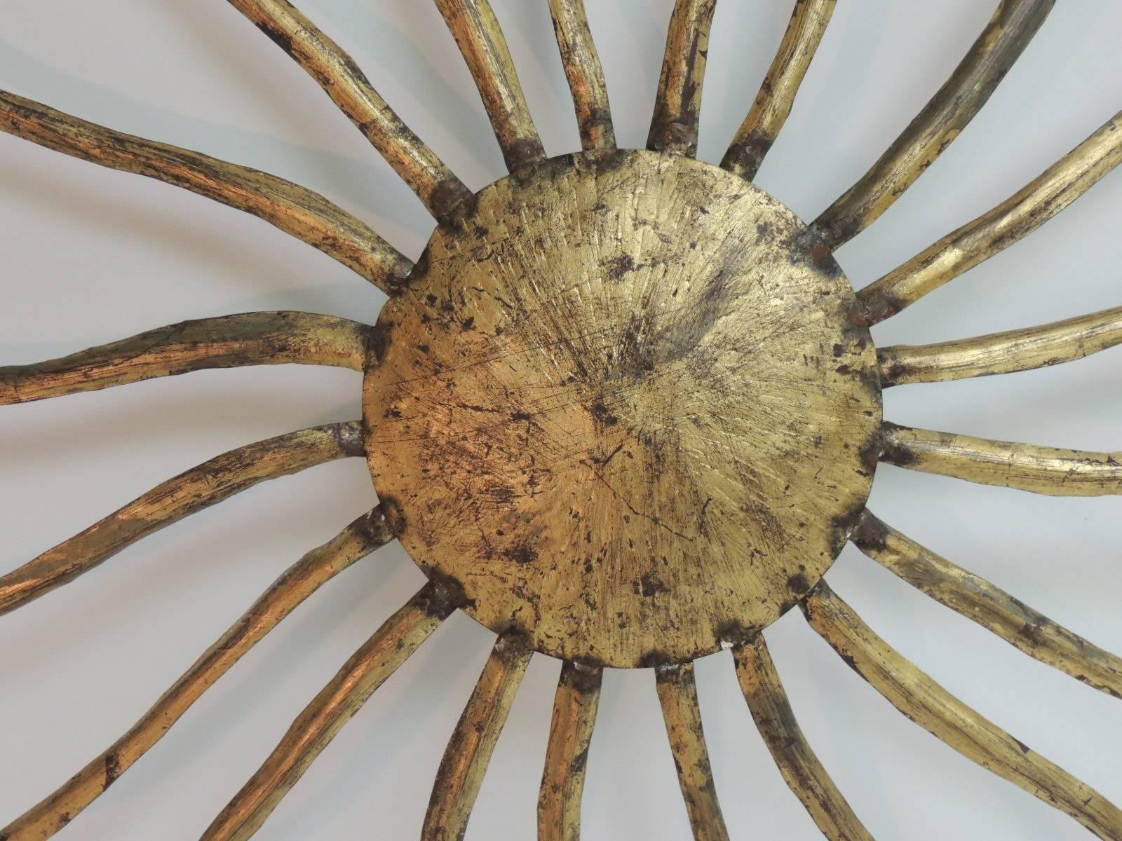 French gilded iron sunburst fixture (fixture only) no attachments to make the hanging ceiling light as you see posted in 1stdibs. Large spikes and circular center.