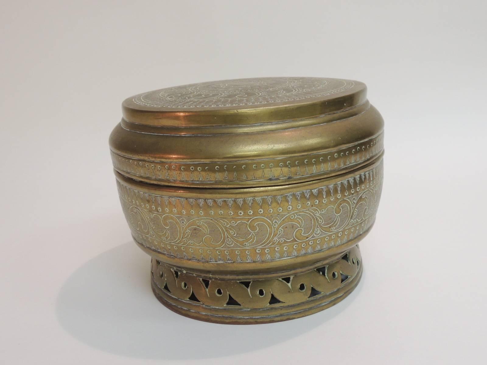 This item is part of our 7th Anniversary SALE:
Vintage brass Persian cachepot with pierced base
The body of this vintage brass lidded box has an intricate hand embossed Persian pattern. 
Hand-forged lidded design with pierced banded foot. Ideal for