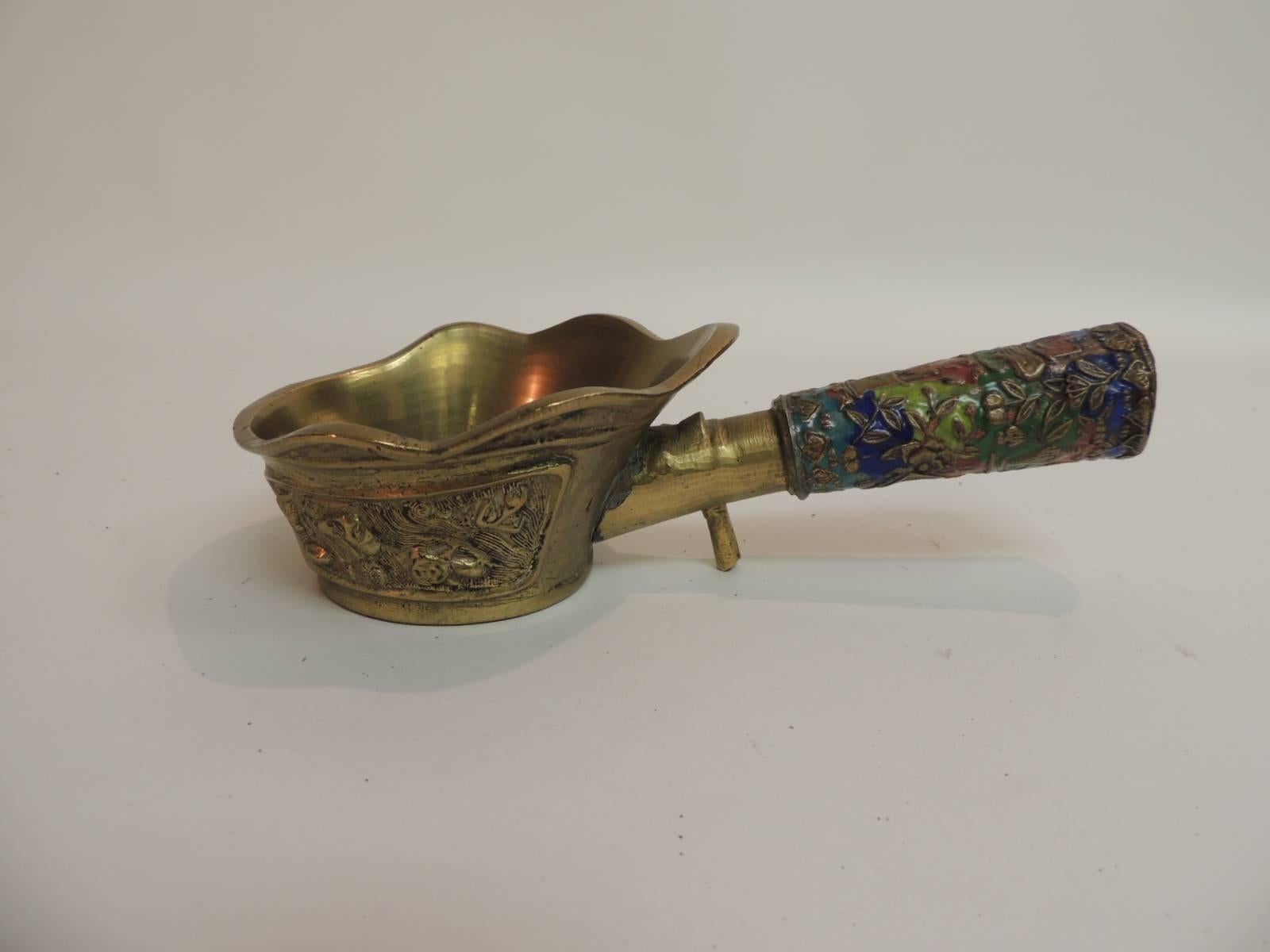 Vintage Asian cloisonné and brass silk iron embellished with a colorful handle depicting vases,
flowers, fruits and birds. Repousse intricate details on the water vessel and stamped.
Size: 2