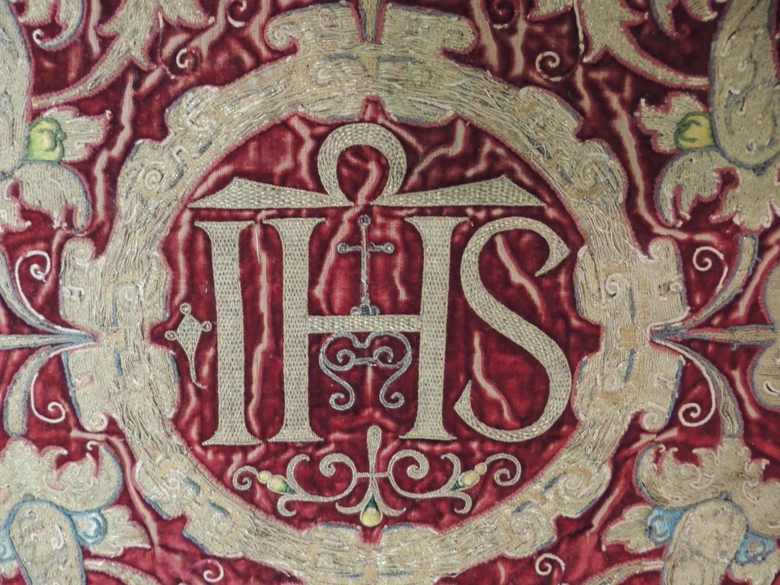 18th century Italian Ecclesiastical gold embroidered on silk velvet panel.
18th century ecclesiastical Italian gold embroidered on silk velvet panel inscribed with letters S.H.I. in the center with a cross and framed with a round medallion of