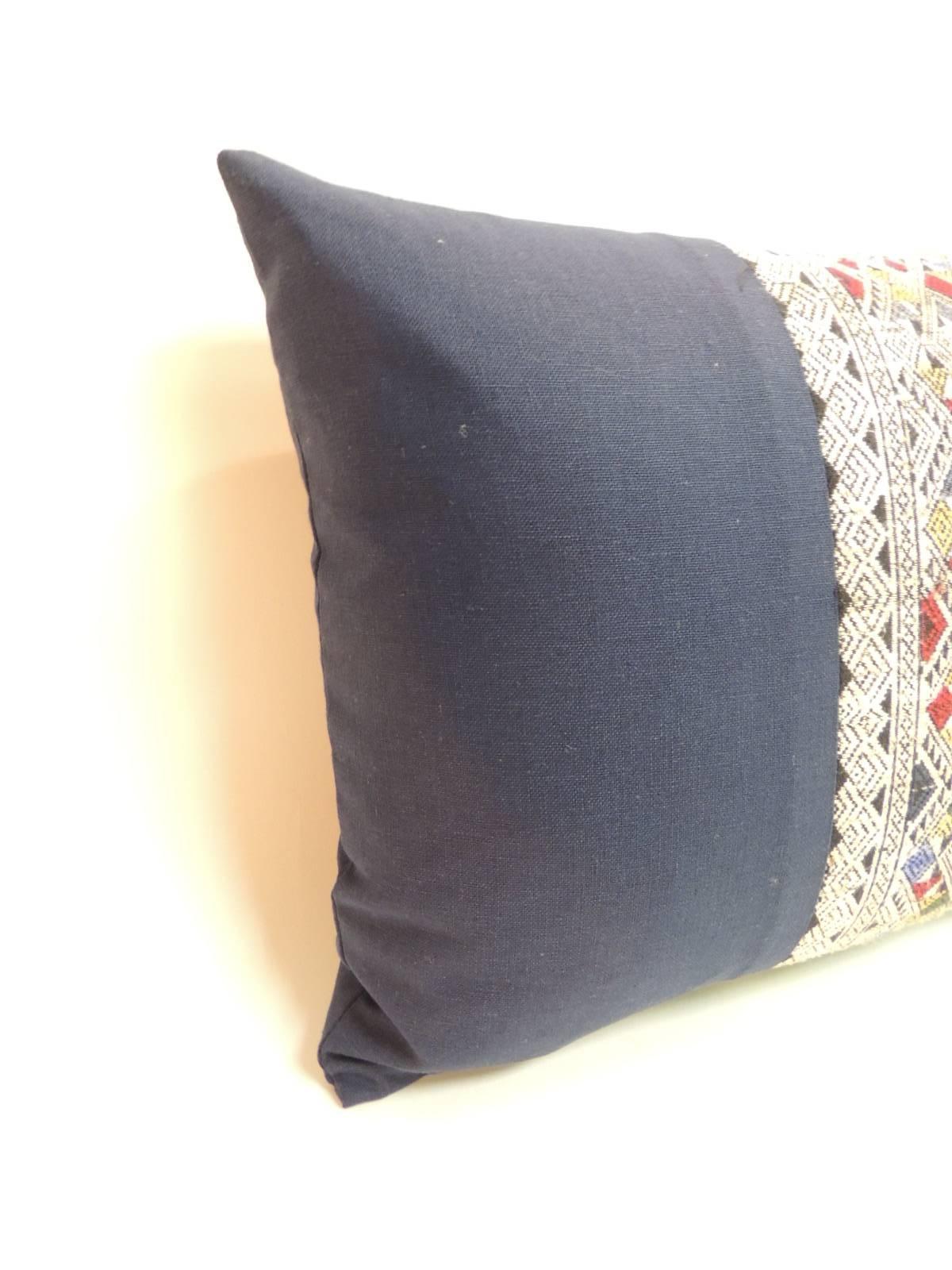 Asian embroidered decorative lumbar pair of pillows with an intricate woven silk-on-silk centered trim framed with royal blue textured linen. The same textured royal blue linen in the front was used to finish the back of the accent pillows. Throw