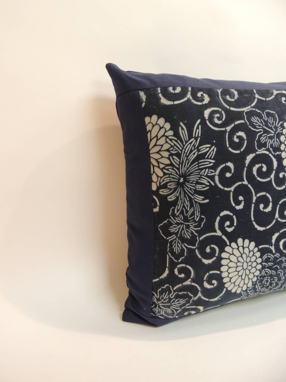 Japanese vintage hand-blocked Chrysanthemum accent bolster pillow with a hand-blocked floral motif. White on indigo vintage textile panel. Throw pillow design embellished with flowers in bloom and scrolling vines in the front textile panel and