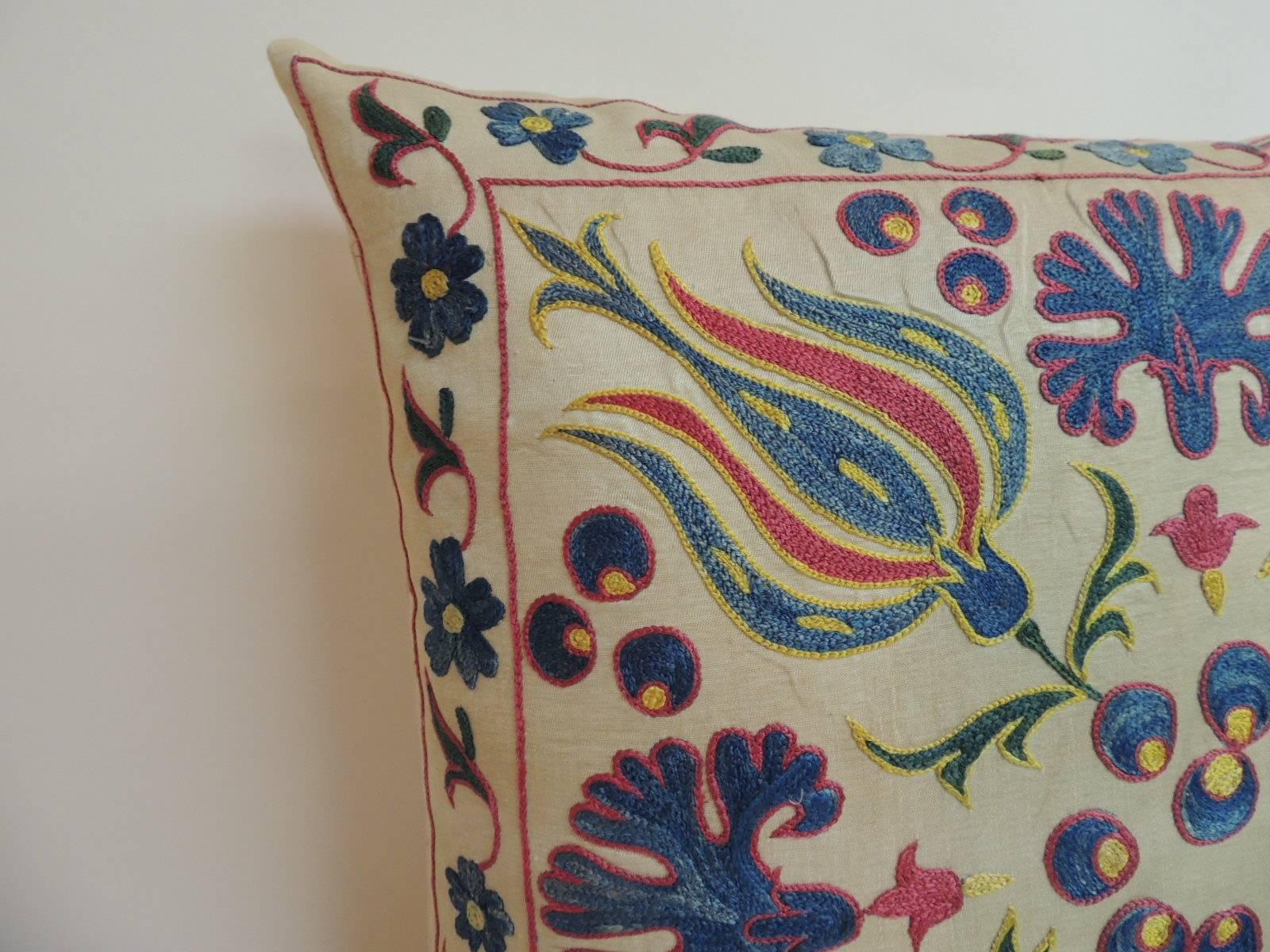 Antique Textiles Galleries:
Vintage floral motif Suzani silk on silk embroidered decorative square pillow. Throw pillow finished with a soft yellow linen backing. Accent Suzani vintage pillow textile In shades of red, blue, yellow, green. Decorative