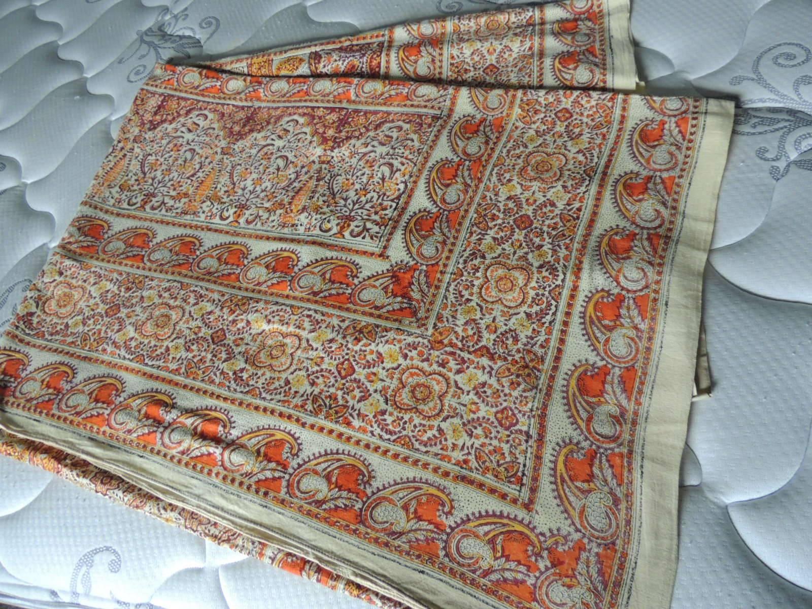 Vintage orange and yellow hand-blocked Indian cloth/bed spread. In shades of natural, orange, yellow and red.
These hand-printed textiles come from the region around Gujarat, India. They are made by different kind of Khatris. These textile fragments