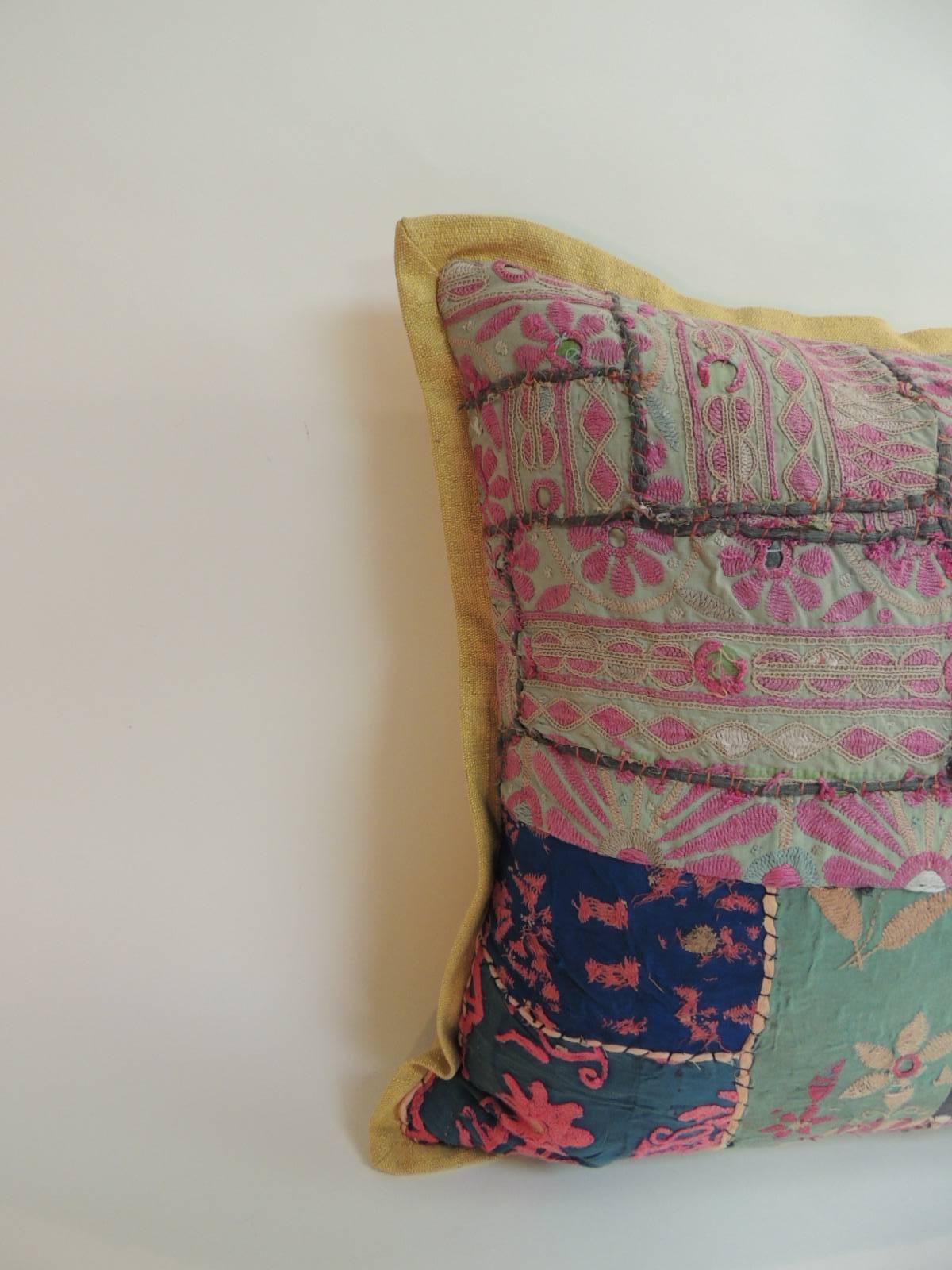 Vintage Indian patchwork colorful decorative floor pillow with textured yellow linen backing and flat trim all around,
In shades of pink, blue, red, yellow, black, purple.
Decorative pillow handcrafted and designed in the USA. Closure by stitch